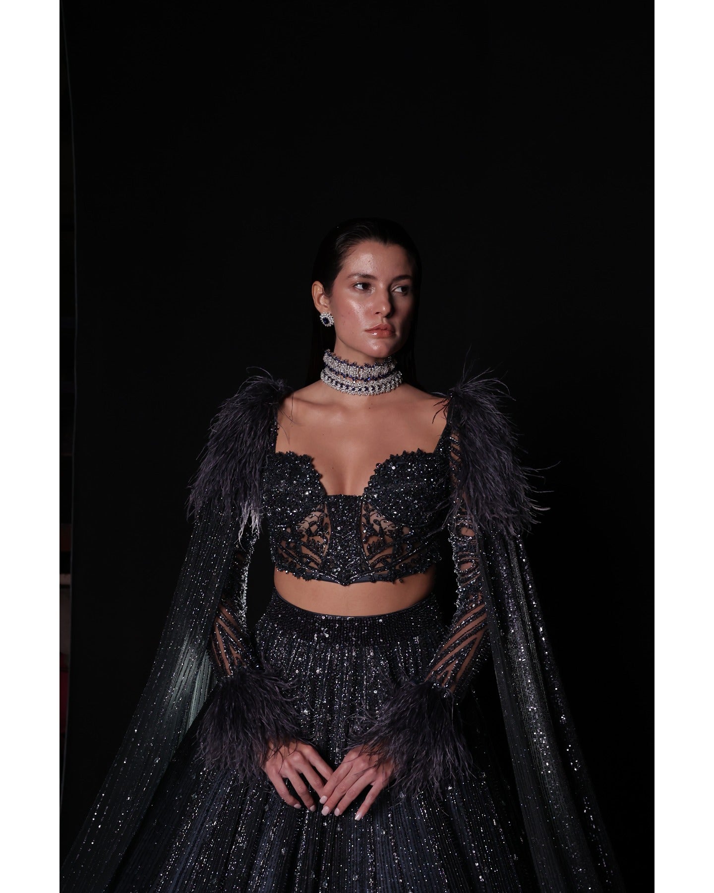 Draped in elegance, the Charcoal Blue Lehenga whispers tales of sophistication and grace.