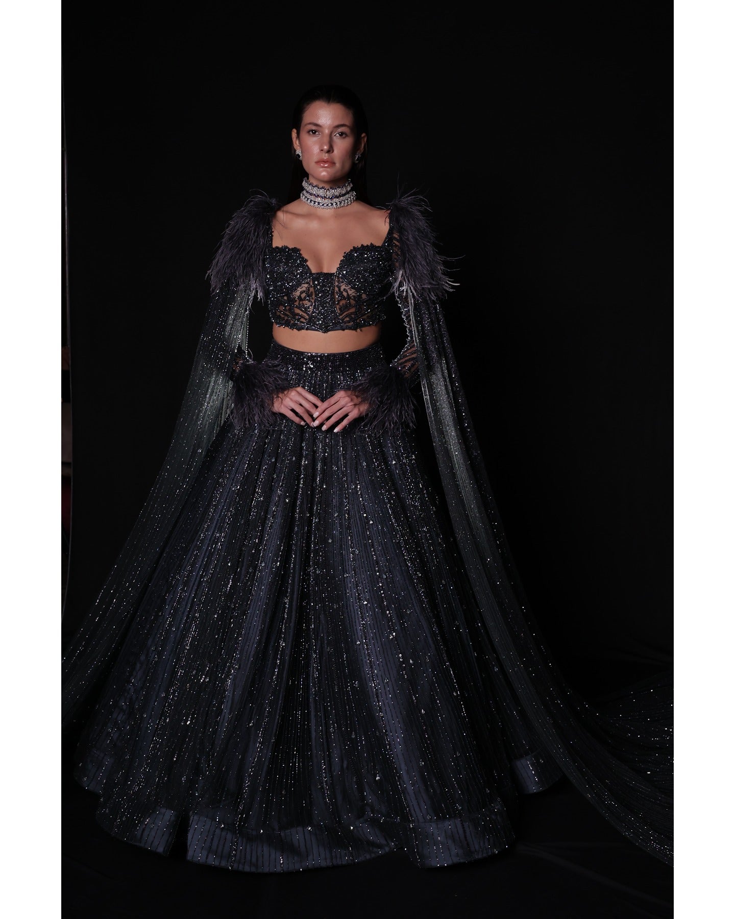 Draped in elegance, the Charcoal Blue Lehenga whispers tales of sophistication and grace.