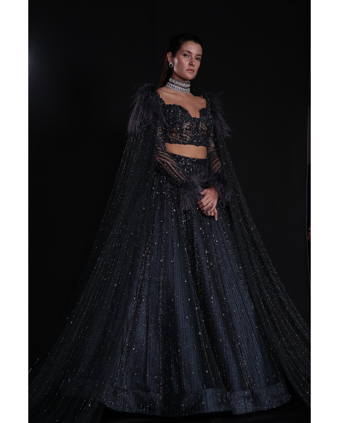 Draped in elegance, the Charcoal Blue Lehenga whispers tales of sophistication and grace.