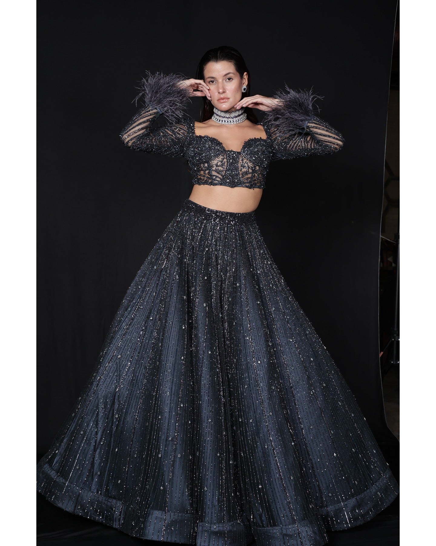 Draped in elegance, the Charcoal Blue Lehenga whispers tales of sophistication and grace.