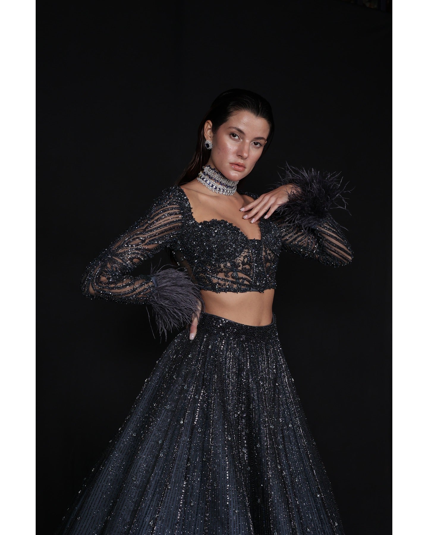 Draped in elegance, the Charcoal Blue Lehenga whispers tales of sophistication and grace.