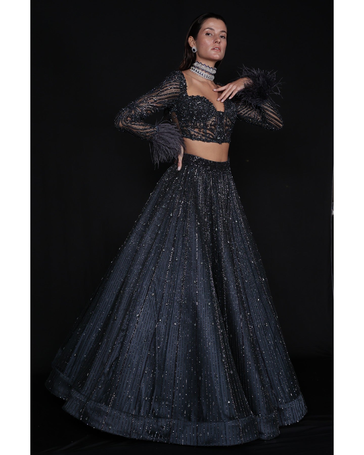 Draped in elegance, the Charcoal Blue Lehenga whispers tales of sophistication and grace.