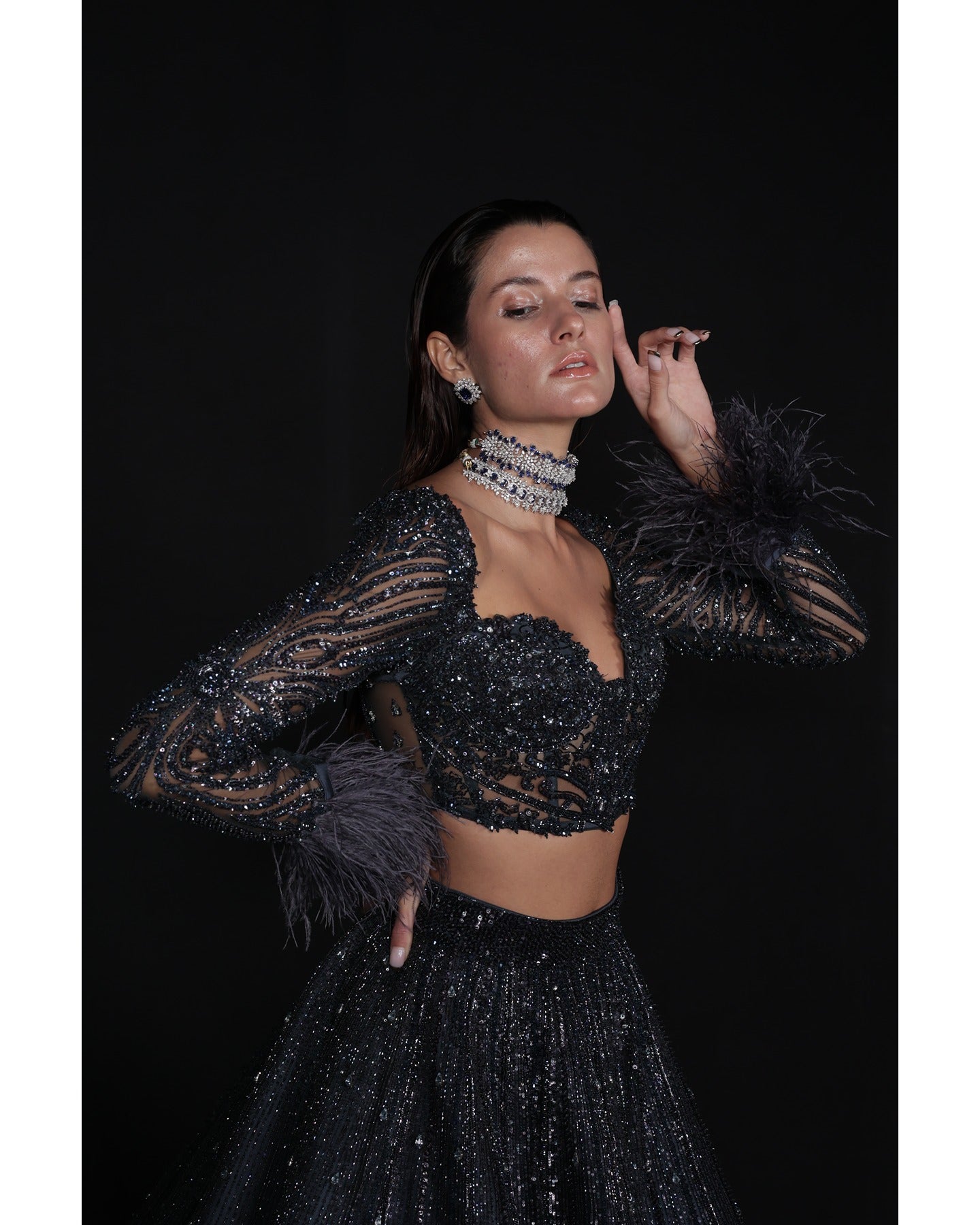 Draped in elegance, the Charcoal Blue Lehenga whispers tales of sophistication and grace.