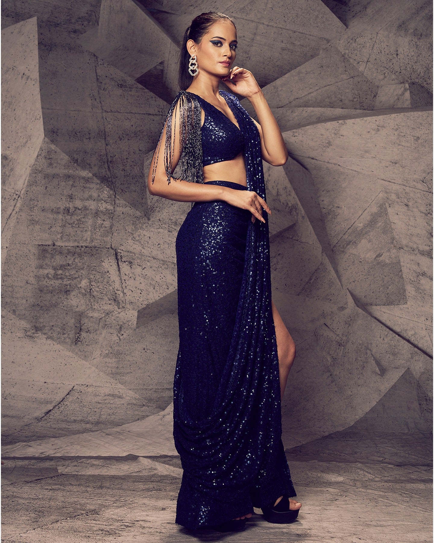 Draped in the enchanting allure of a slit saree, this ensemble redefines elegance with a contemporary twist.