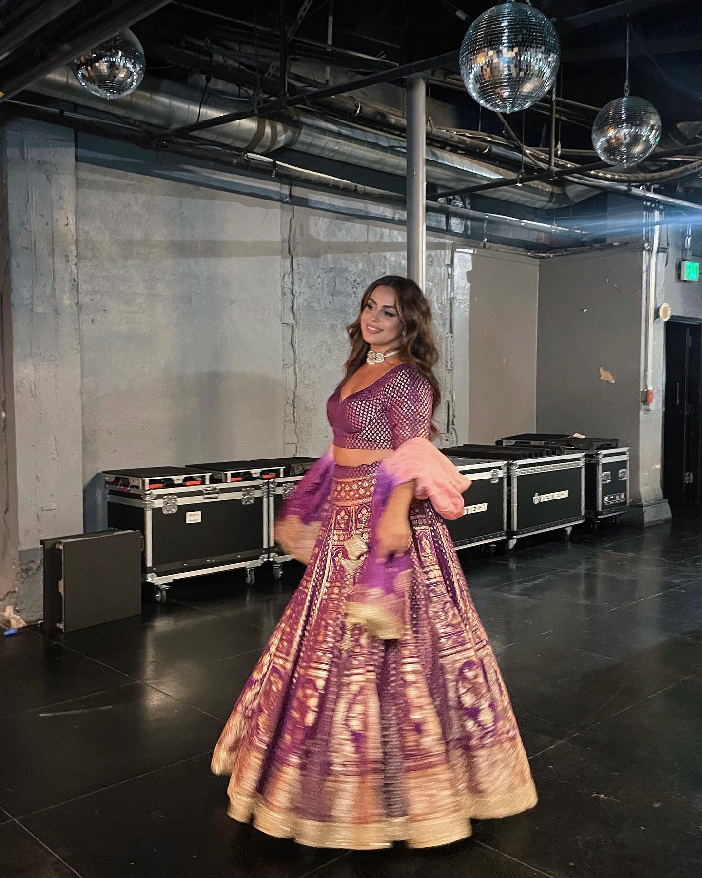 Intricately embroidered bridal lehenga with gold and Purple embellishments