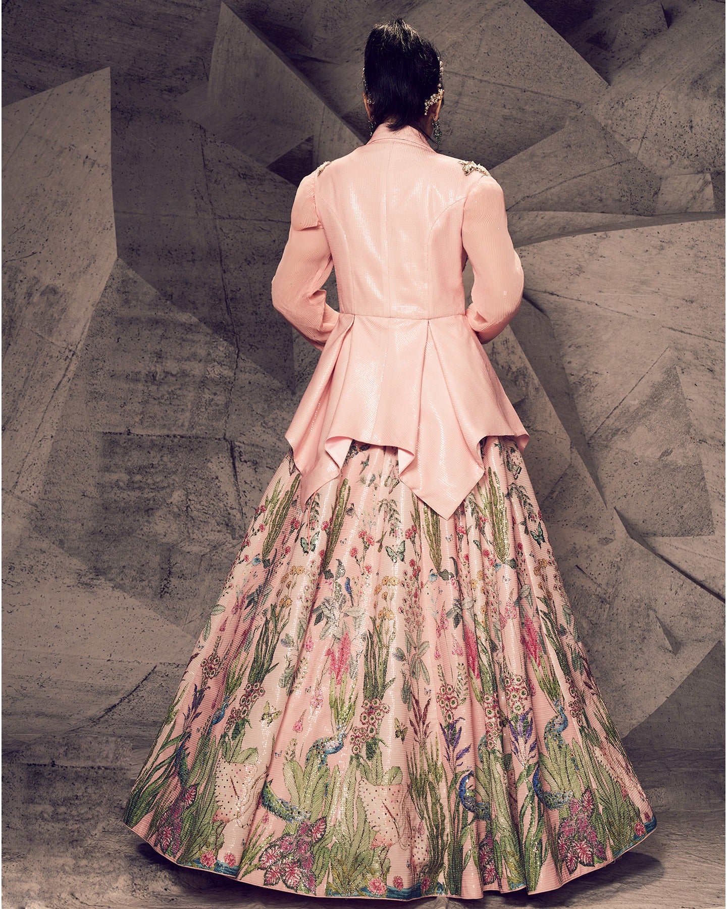 Blossoming in the elegance of pink florals, this blazer lehenga ensemble is a garden of sophistication and style.