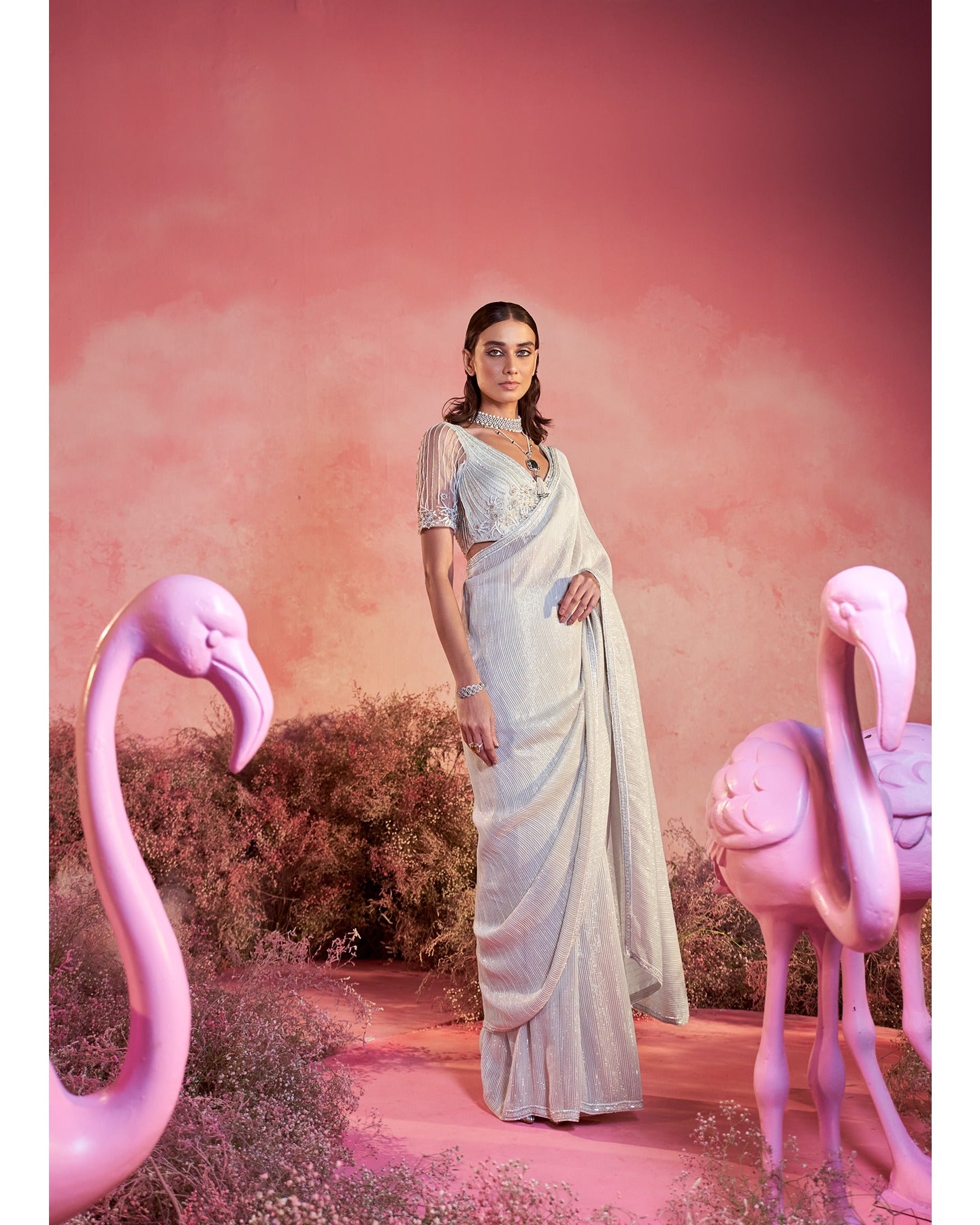 Whispers of Elegance: Embracing the artistry of hand-embroidery in this pristine white saree set.