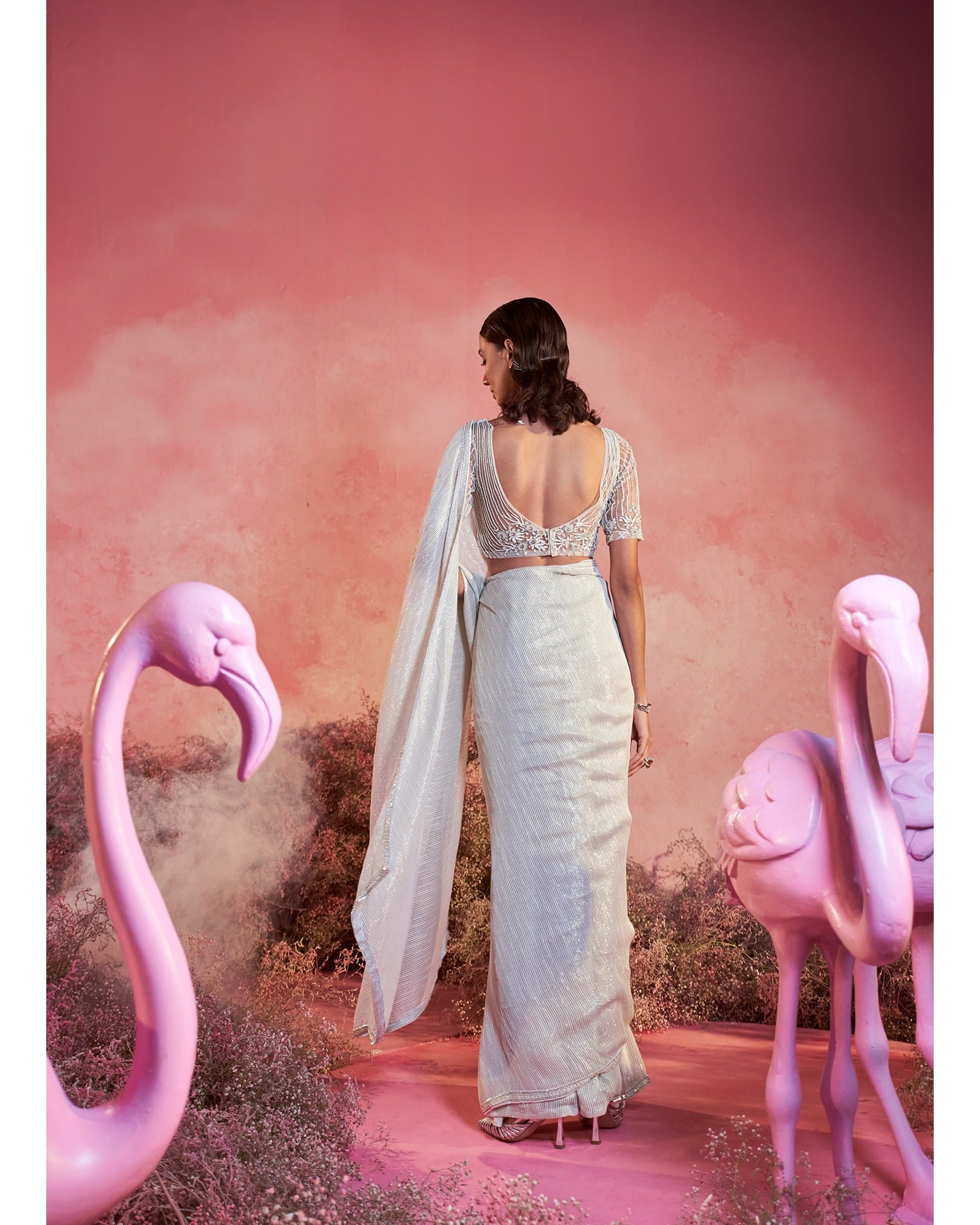 Whispers of Elegance: Embracing the artistry of hand-embroidery in this pristine white saree set.