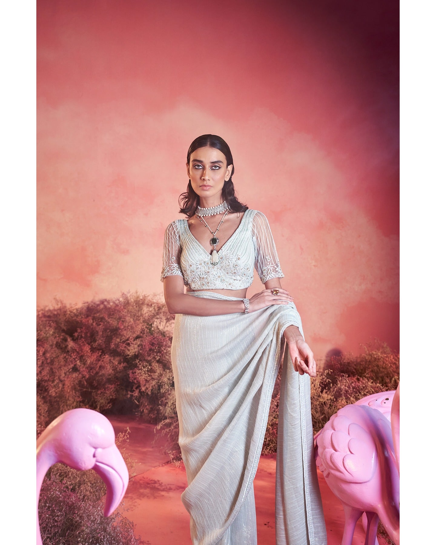 Whispers of Elegance: Embracing the artistry of hand-embroidery in this pristine white saree set.