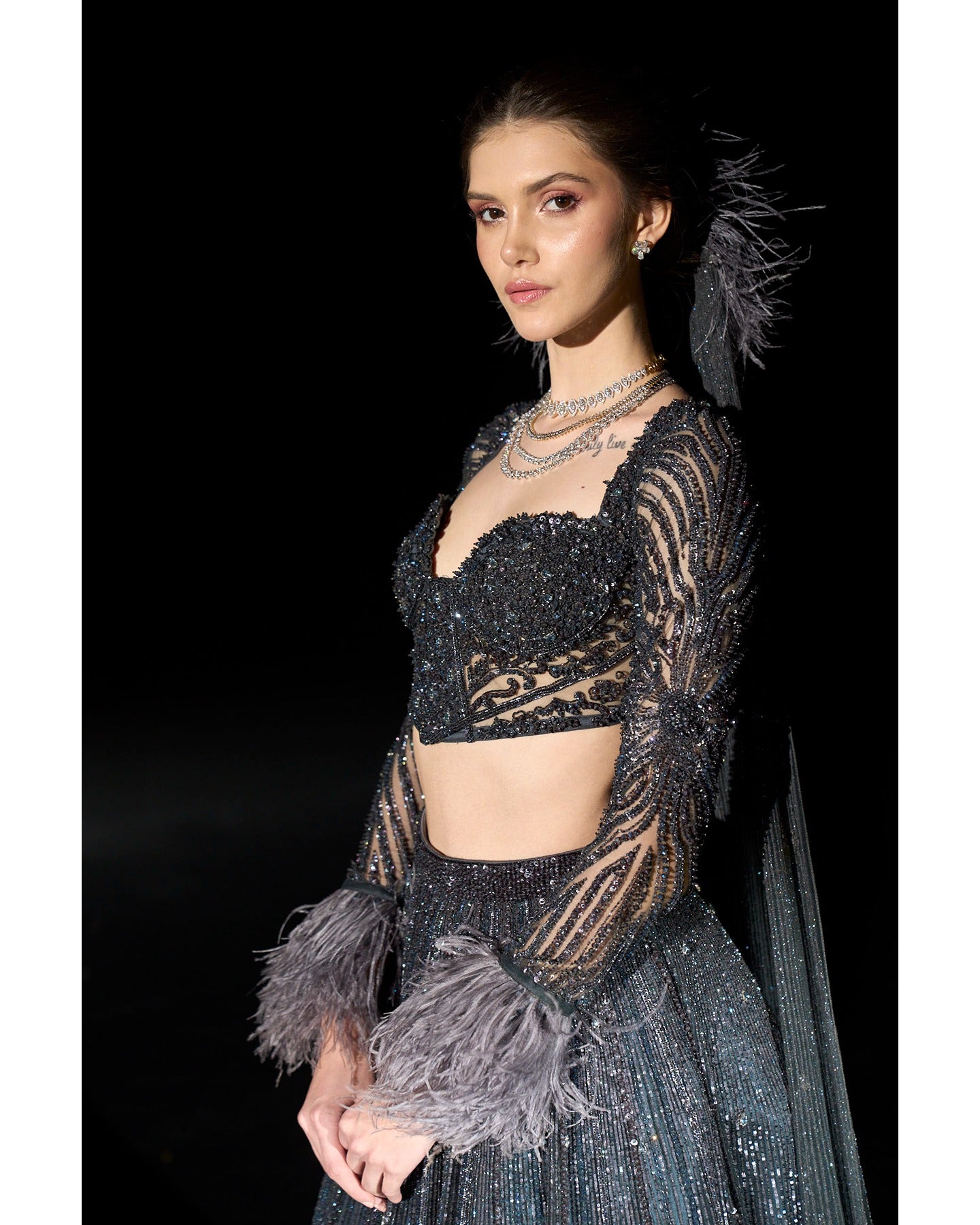 Draped in elegance, the Charcoal Blue Lehenga whispers tales of sophistication and grace.