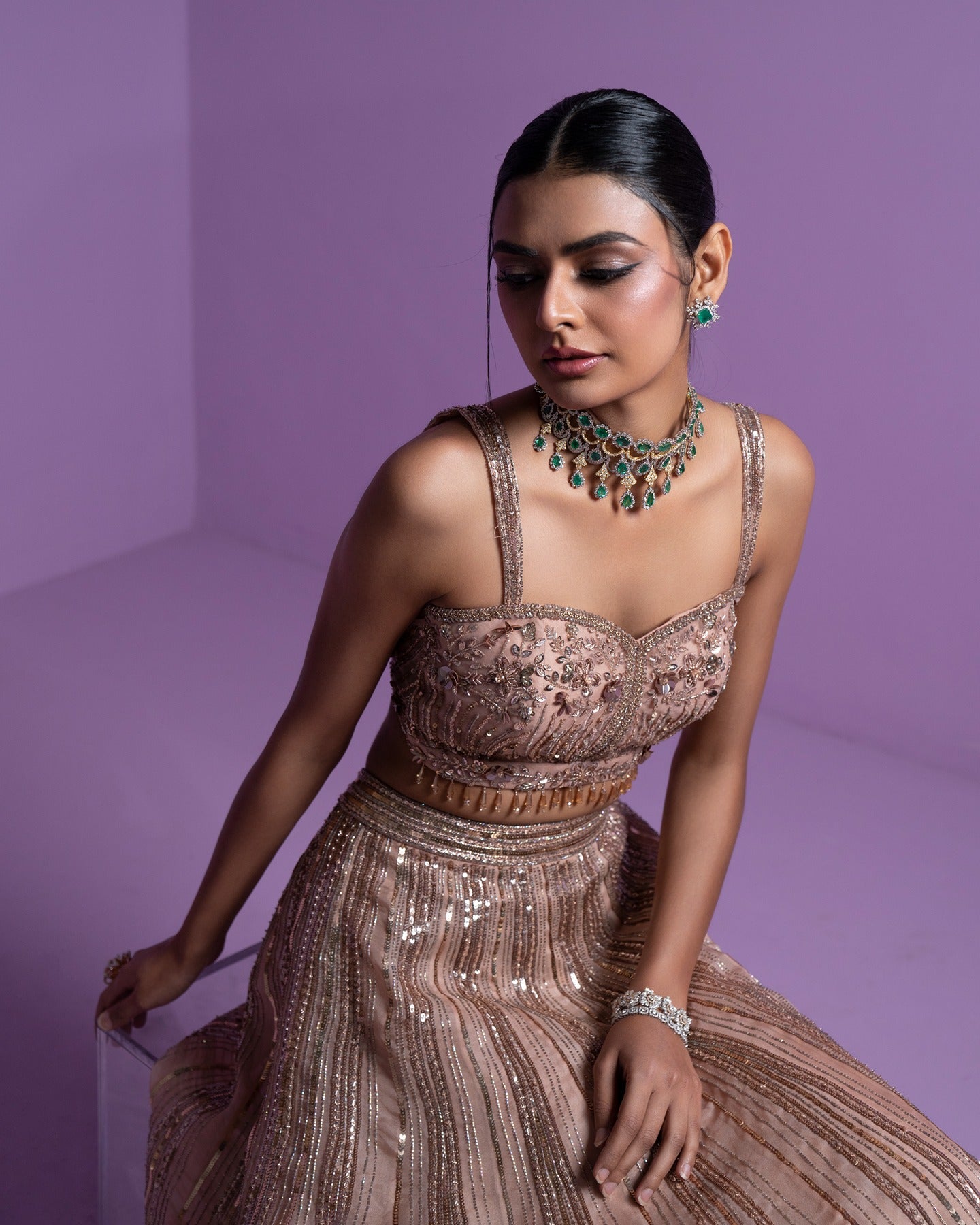 Draped in elegance and adorned in gold, this lehenga radiates timeless beauty and regal charm. A touch of glamour for moments that shimmer with splendor.