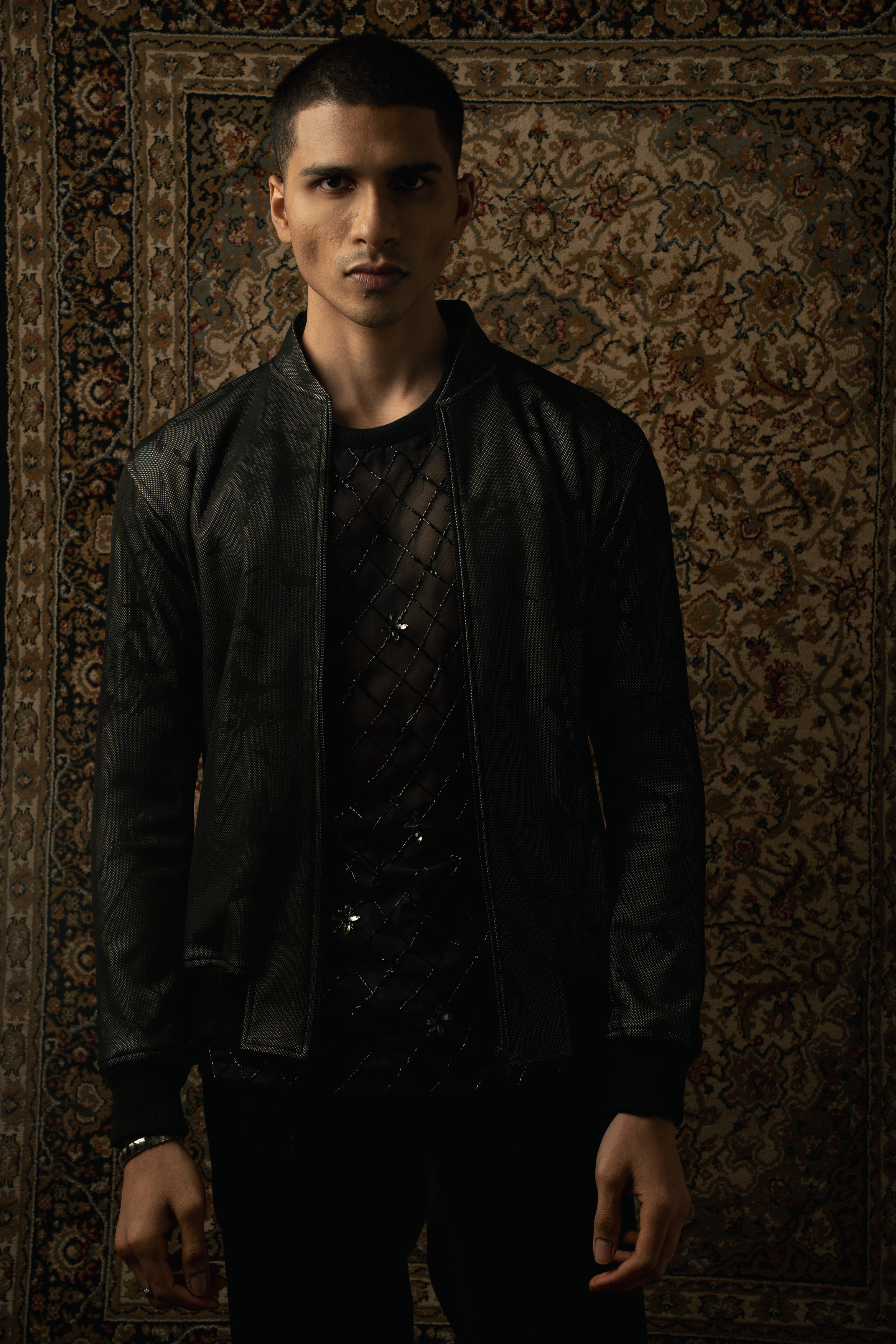 Sleek and stylish: Make a statement in monochrome with this printed Lycra jacket, double T-shirt, and black pants ensemble, exuding urban sophistication.