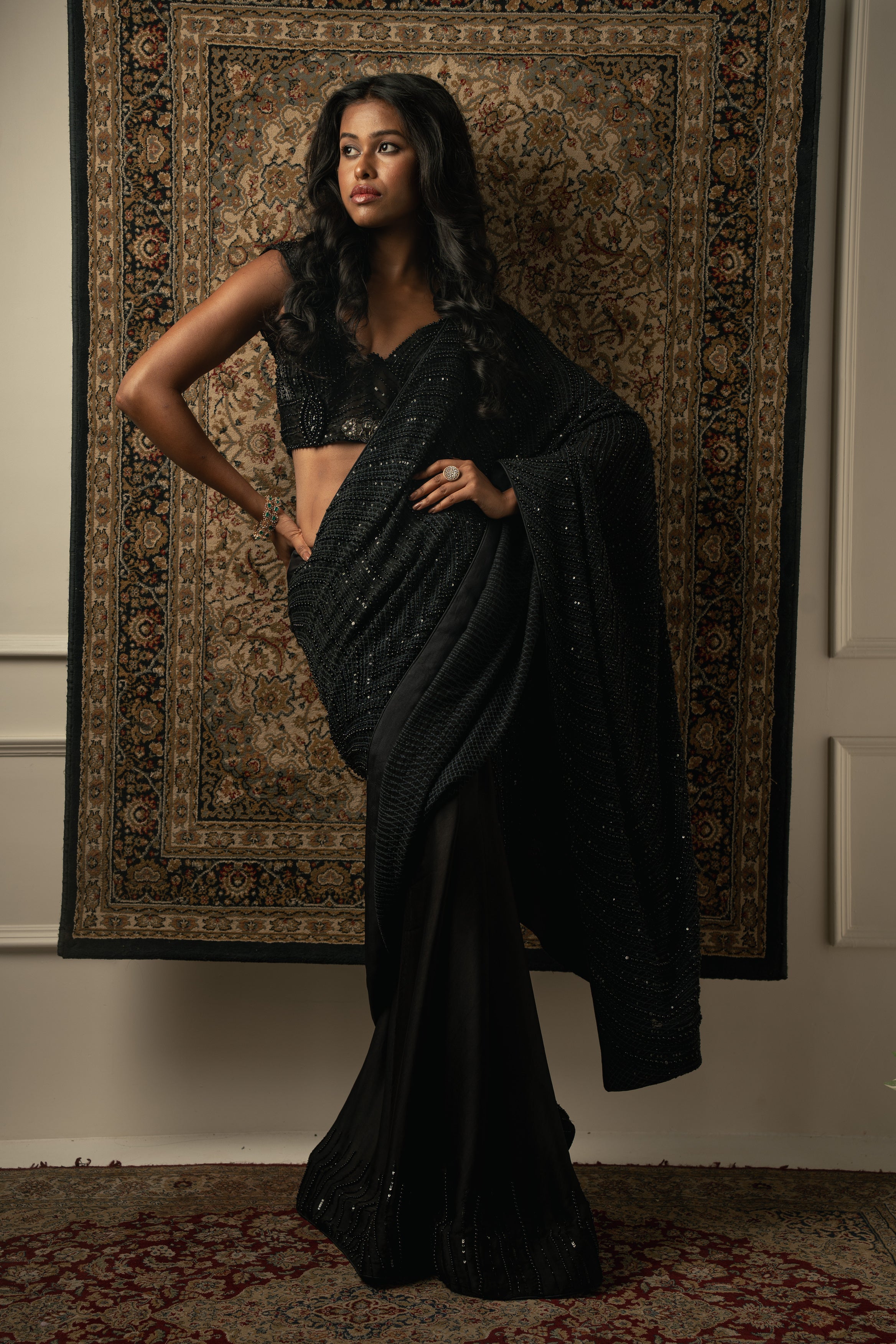 Draped in elegance: Silk satin and georgette saree paired with a shimmer organza blouse. Black never looked so chic.