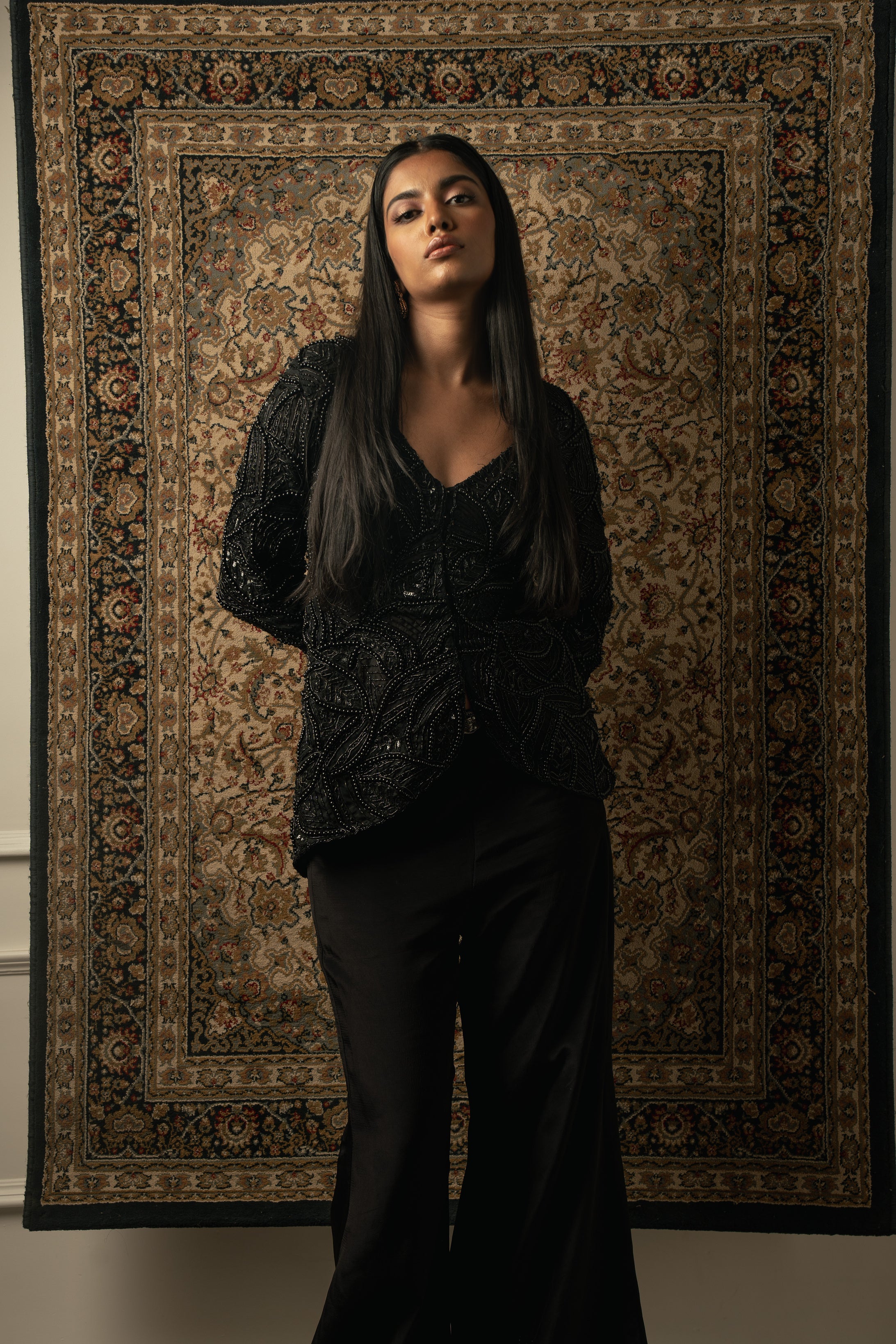Master the art of chic dressing with this black organza jacket and silk plazzo ensemble. Classic yet modern.