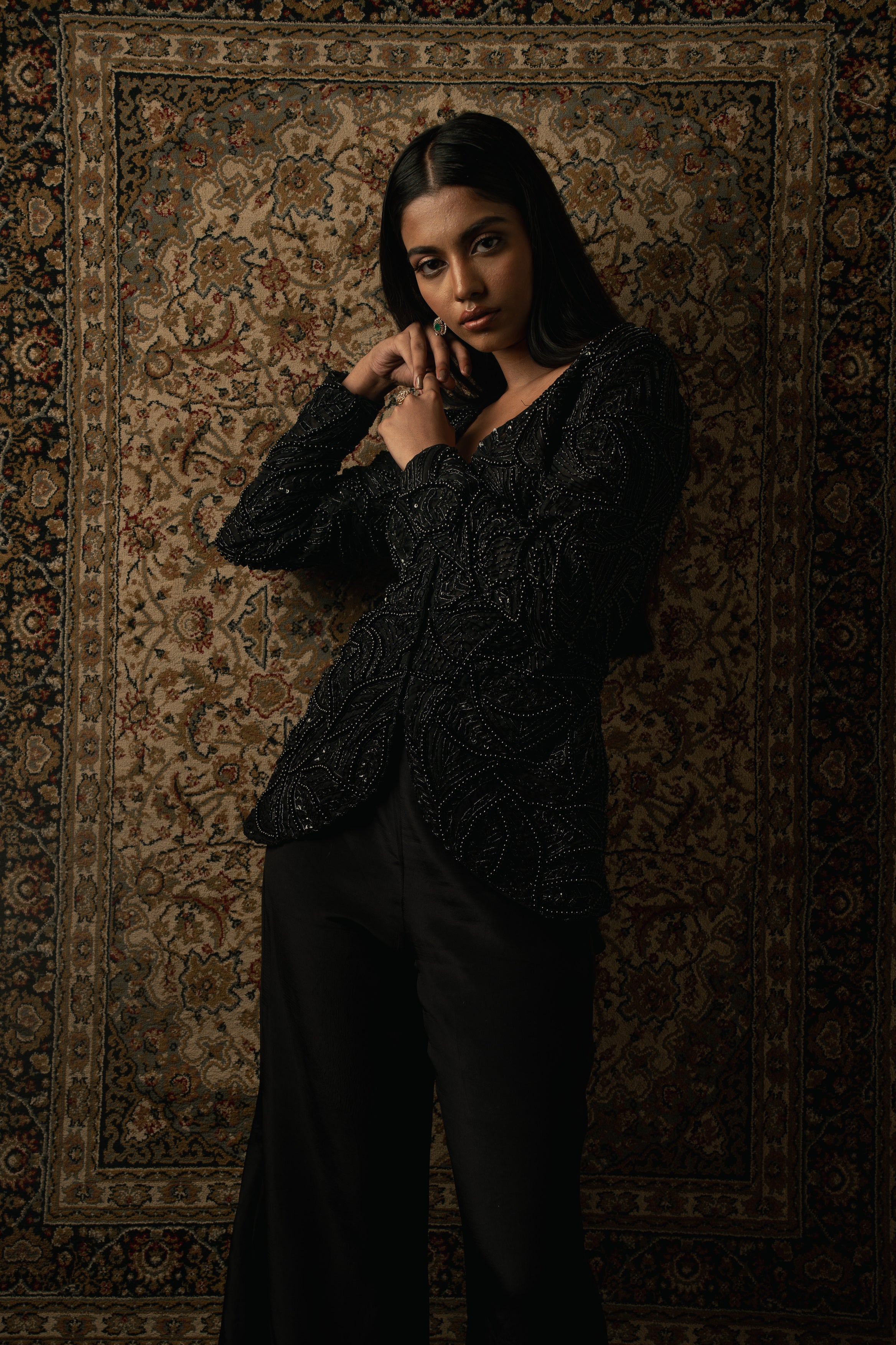 Make a bold statement in black: Organza jacket layered over silk plazzo for an exquisite fusion of elegance and style.
