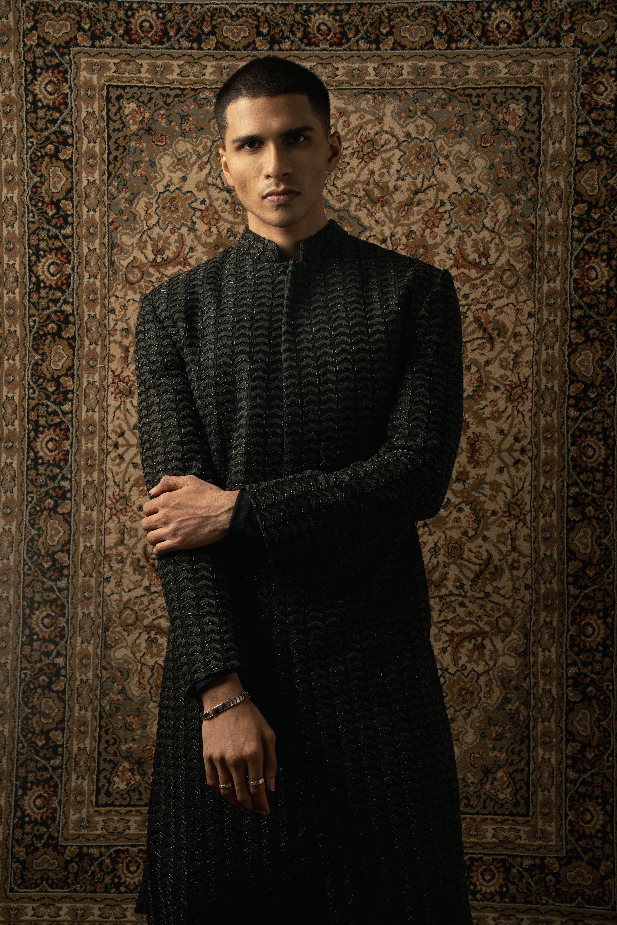 Exude timeless elegance in this Black Silk Sherwani paired with Spandex Kurta and Pants, a fusion of tradition and modernity.
