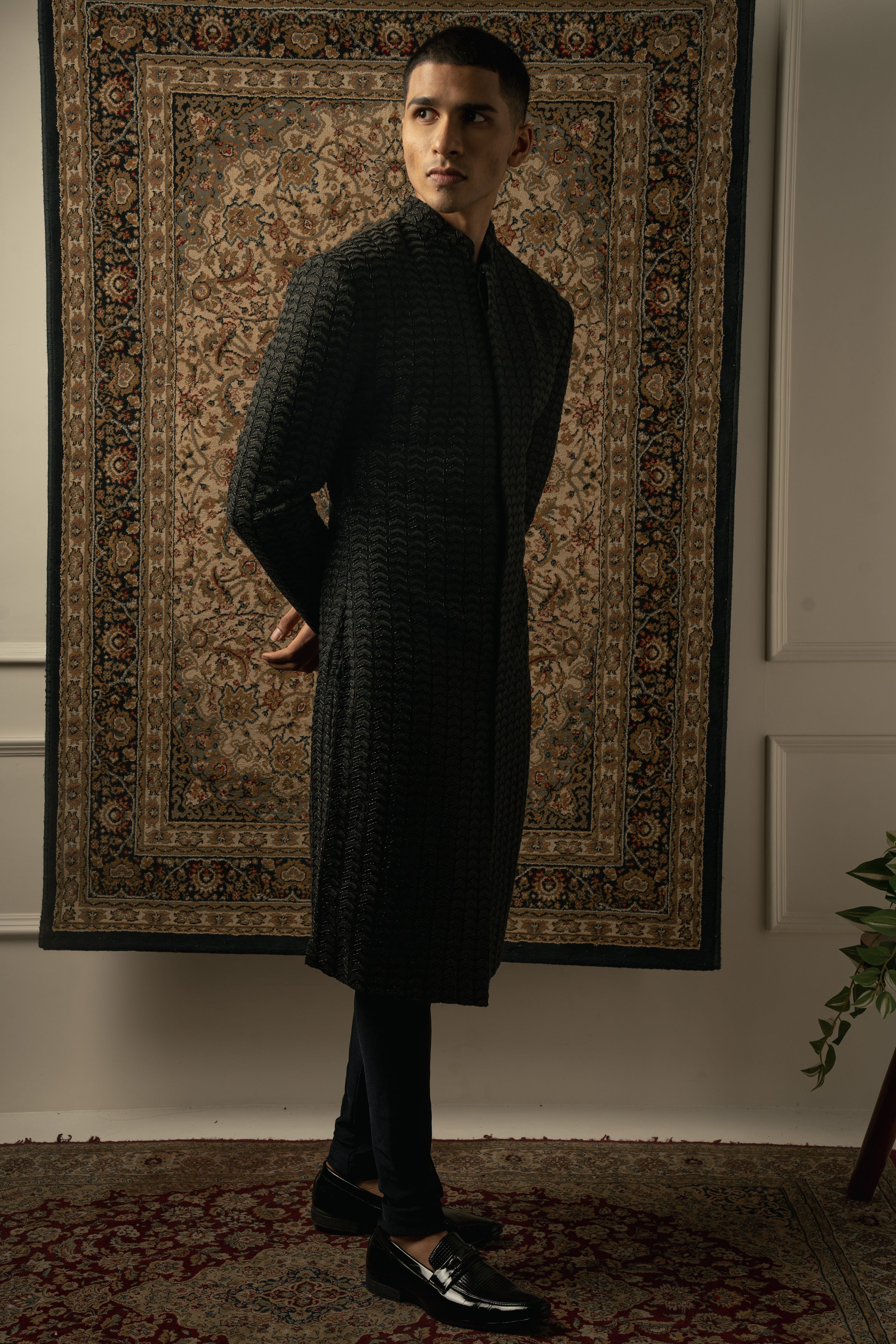 Make a statement in sophistication with this Black Silk Sherwani, complemented by Spandex Kurta and Pants for a contemporary twist.