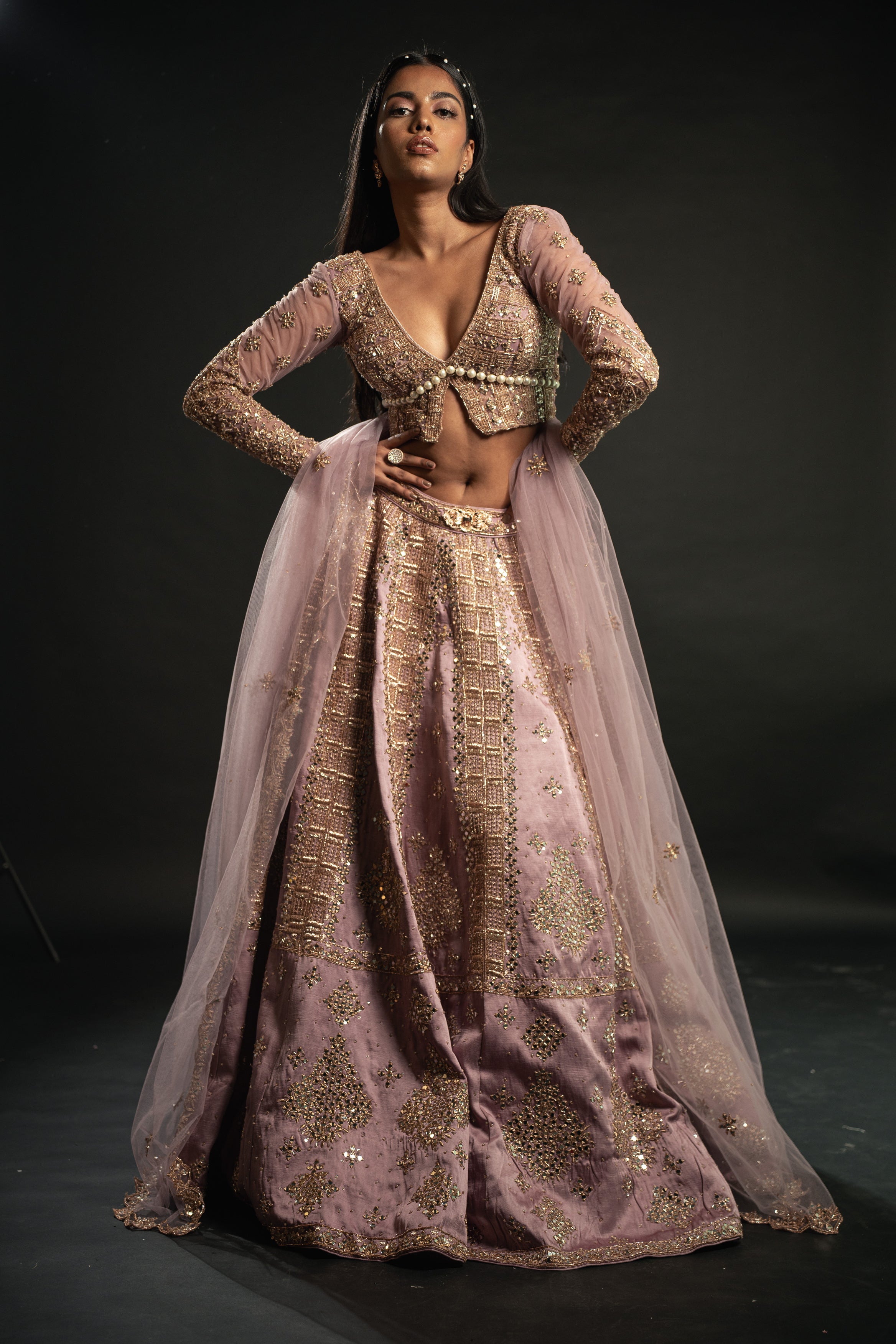Elevate your charm in Lilac: Linen Satin Lehenga paired with a Net blouse and Dupatta, a vision of grace and sophistication.