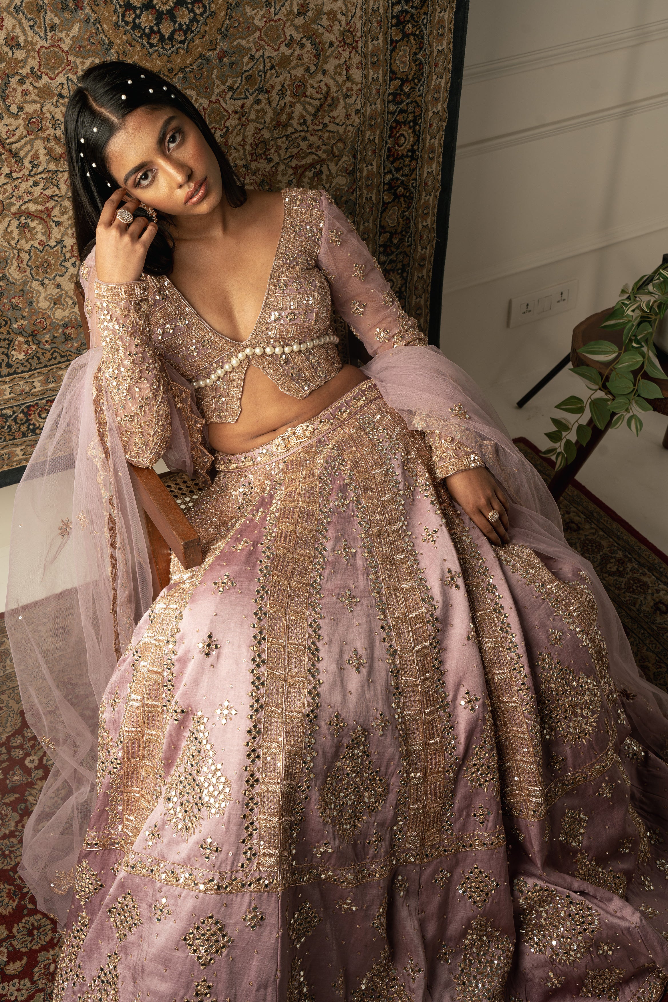 Step into a world of elegance with this Lilac Linen Satin Lehenga, adorned with a delicate Net blouse and Dupatta, a timeless ensemble for the modern woman.