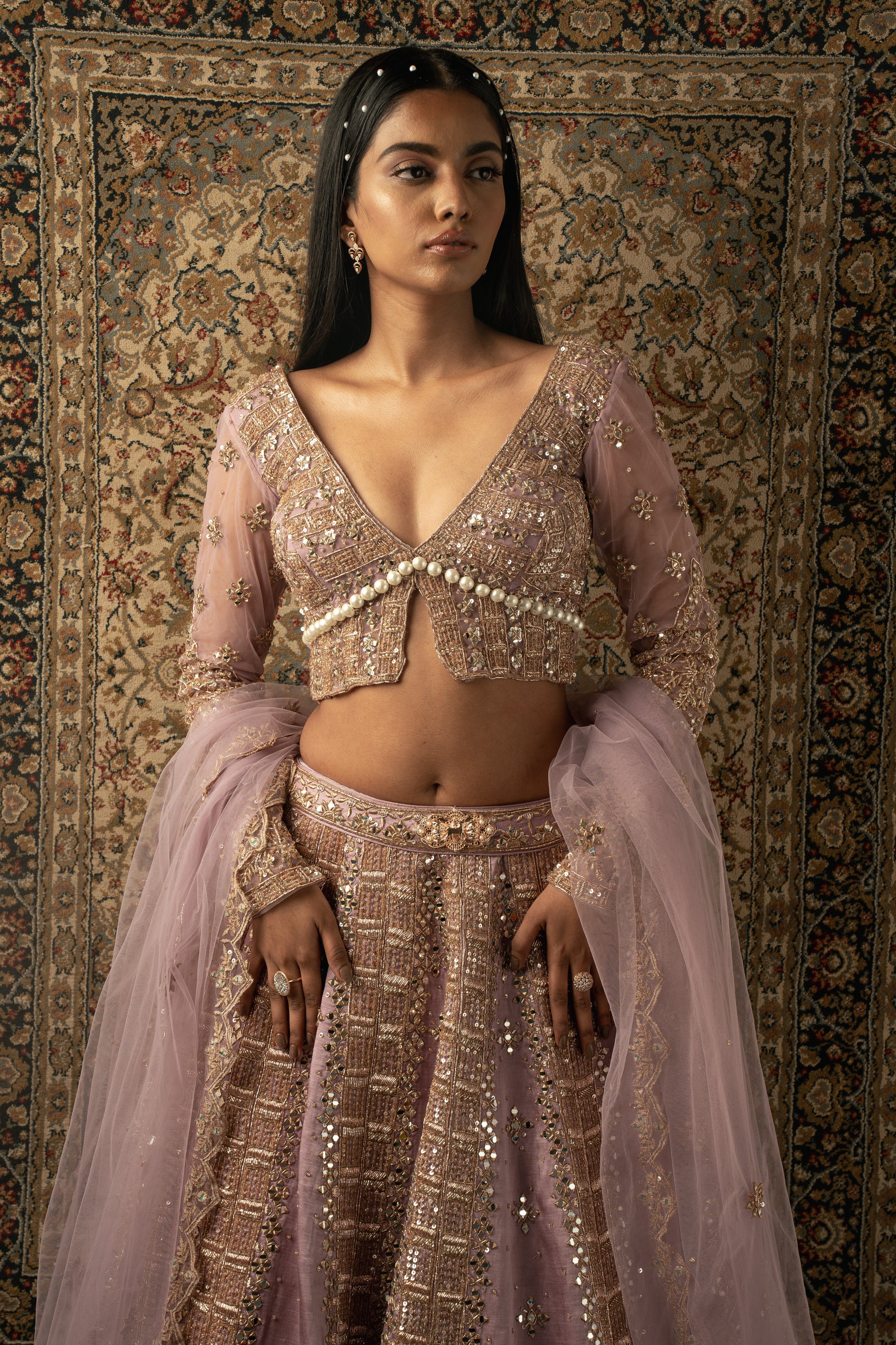 Embrace ethereal beauty: Lilac Linen Satin Lehenga complemented by a Net blouse and Dupatta, a stunning ensemble that captivates hearts.
