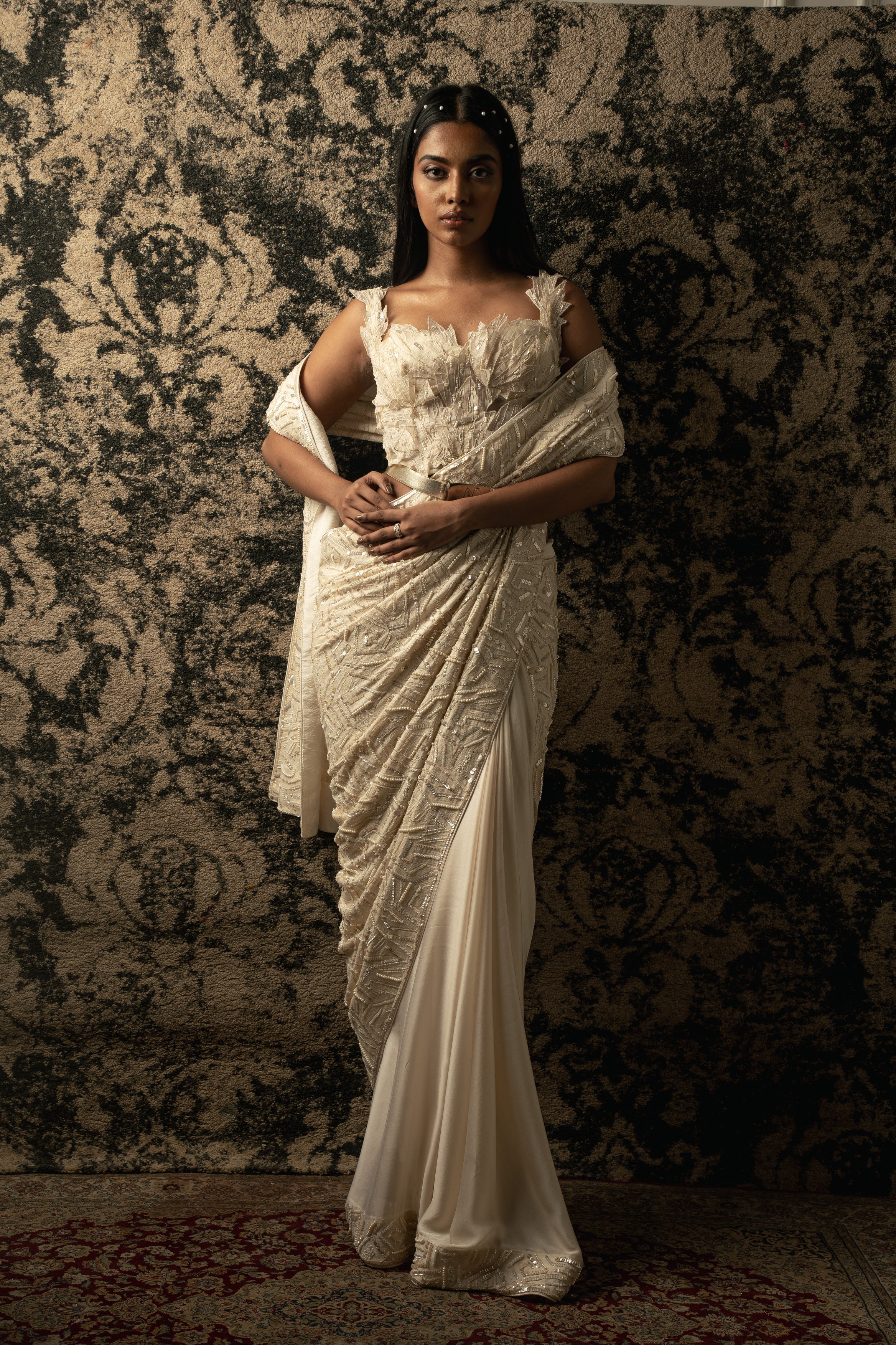 Drape yourself in elegance: Ivory Silk Satin and Georgette Saree adorned with intricate thread embroidery, paired with a delicate Net blouse and satin stretch petticoat.