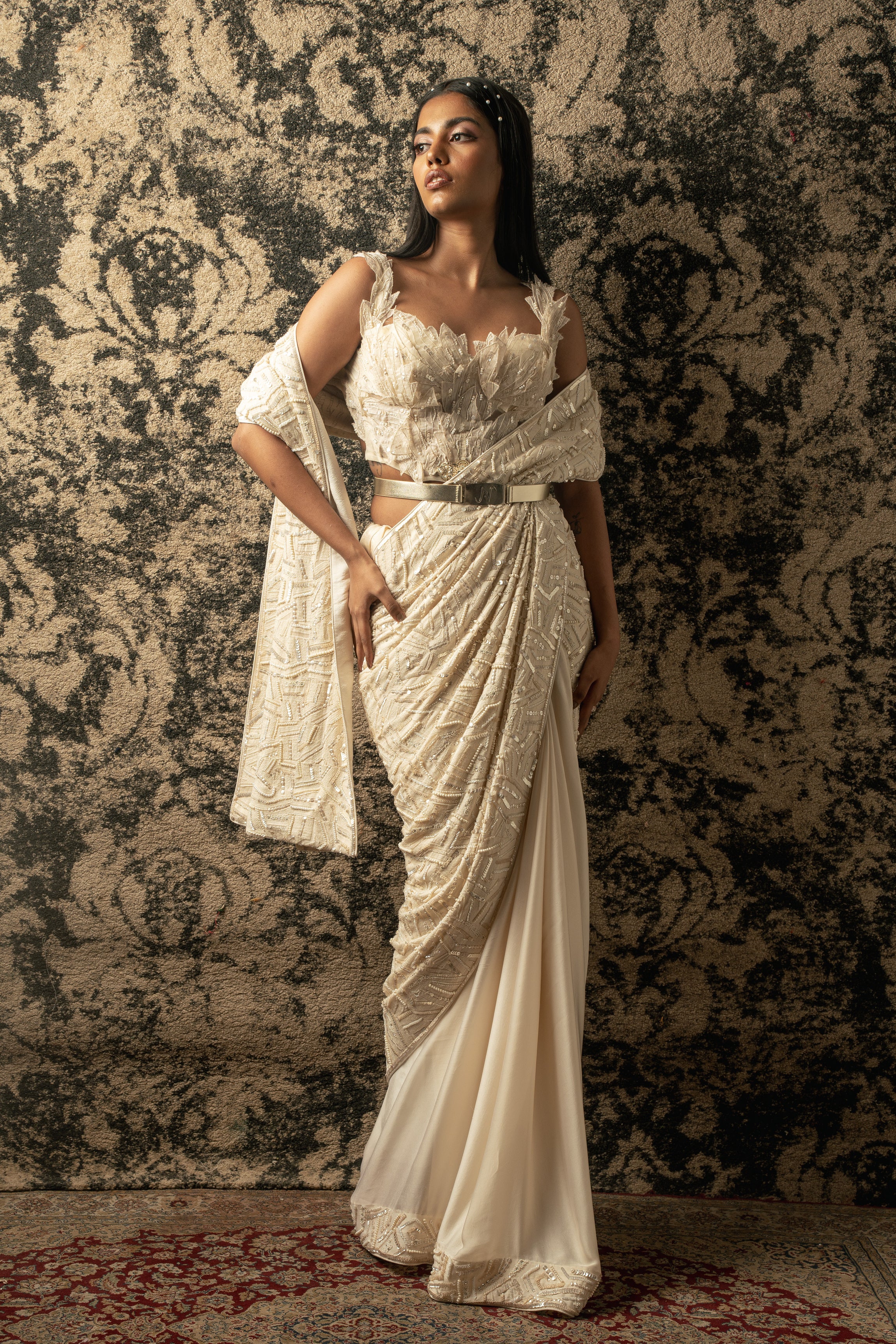 Elevate your grace in Ivory: Silk Satin and Georgette Saree paired with a Net blouse and satin stretch petticoat, a timeless ensemble that exudes sophistication.