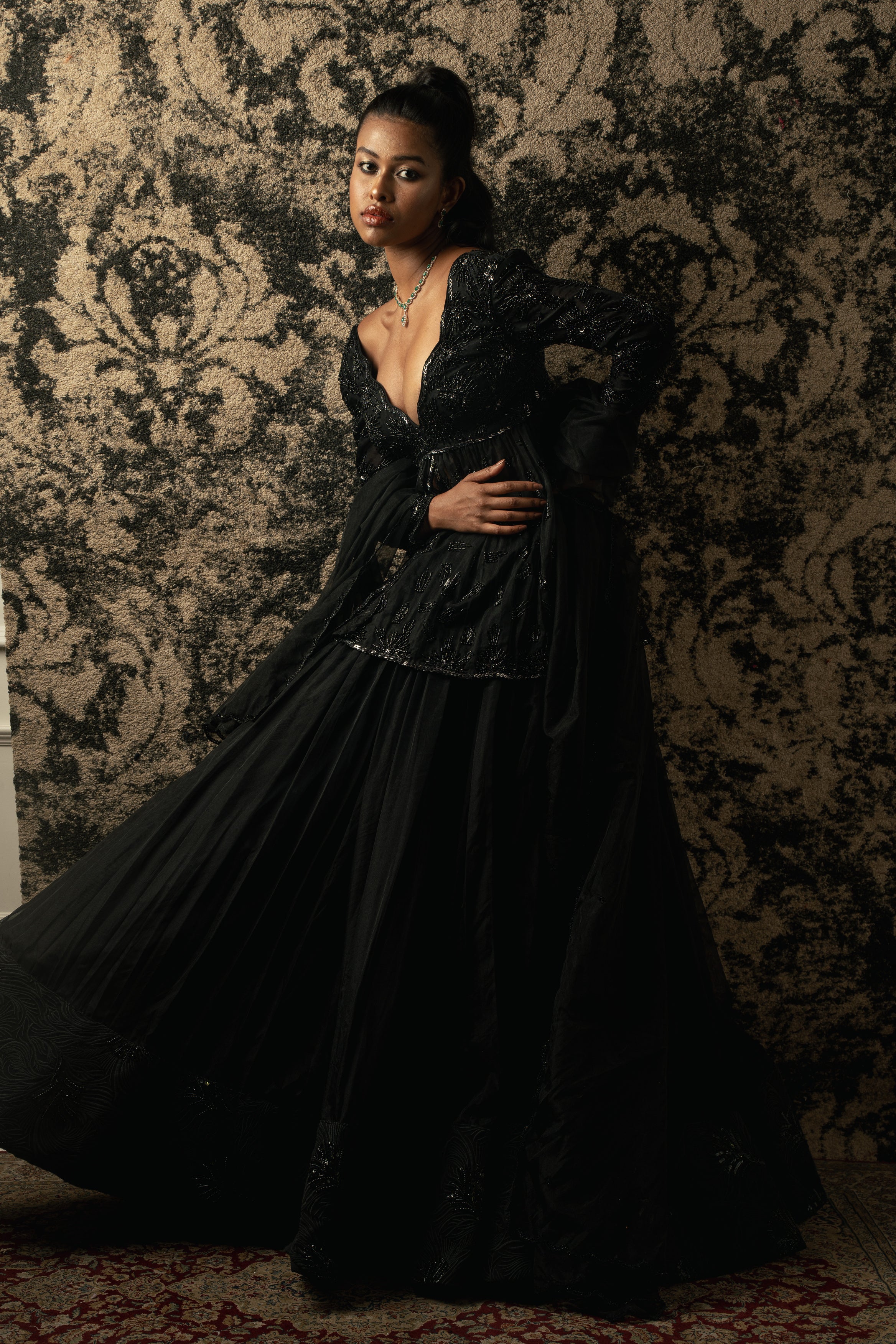 Black beauty redefined: This Organza Peplum Kurta and Lehenga ensemble epitomizes understated luxury and timeless style.