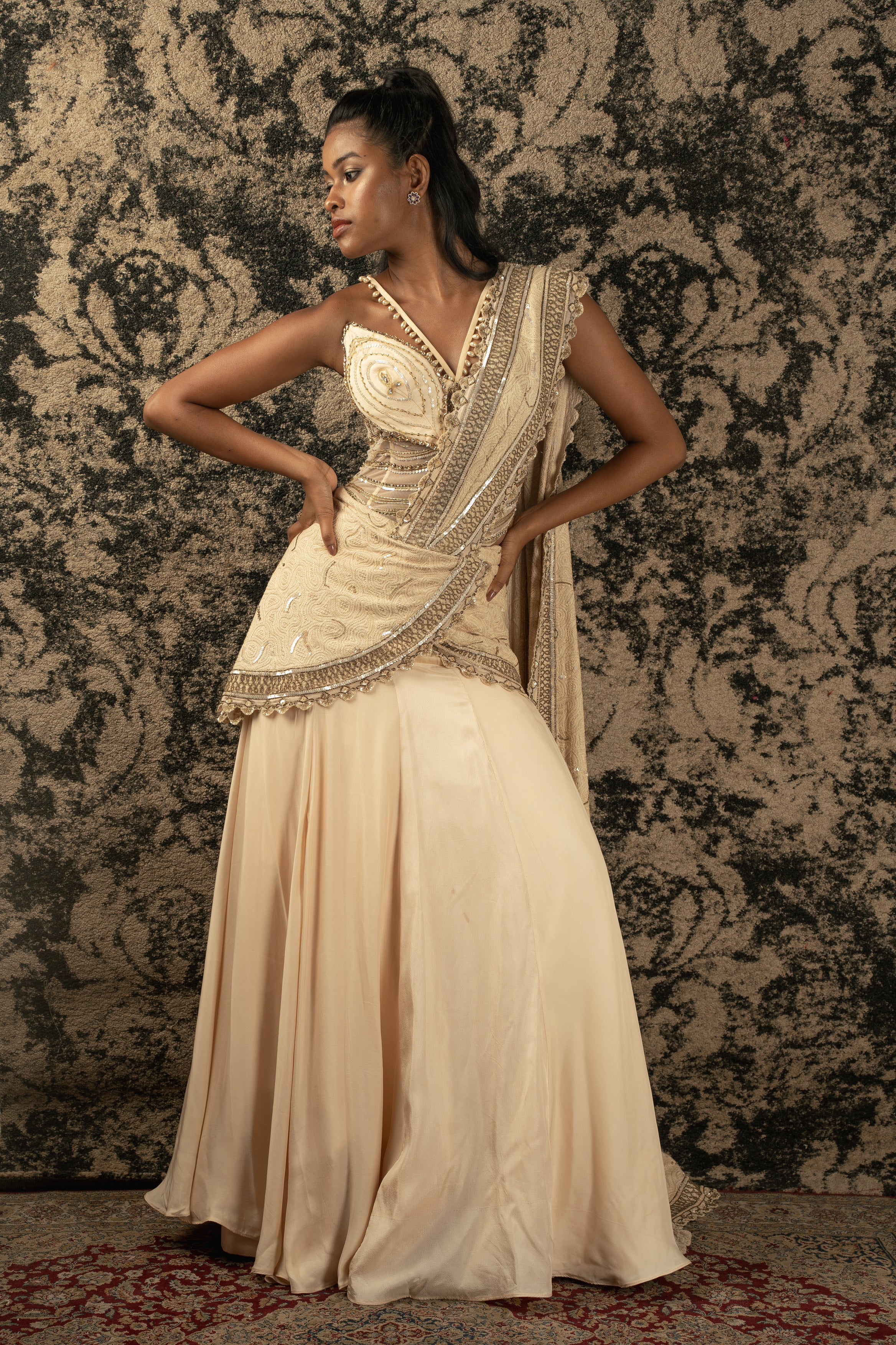 Illuminate the room in Light Gold: Silk Satin skirt paired with a Net blouse and Luckhnawi Silk drape, a radiant ensemble exuding timeless charm.