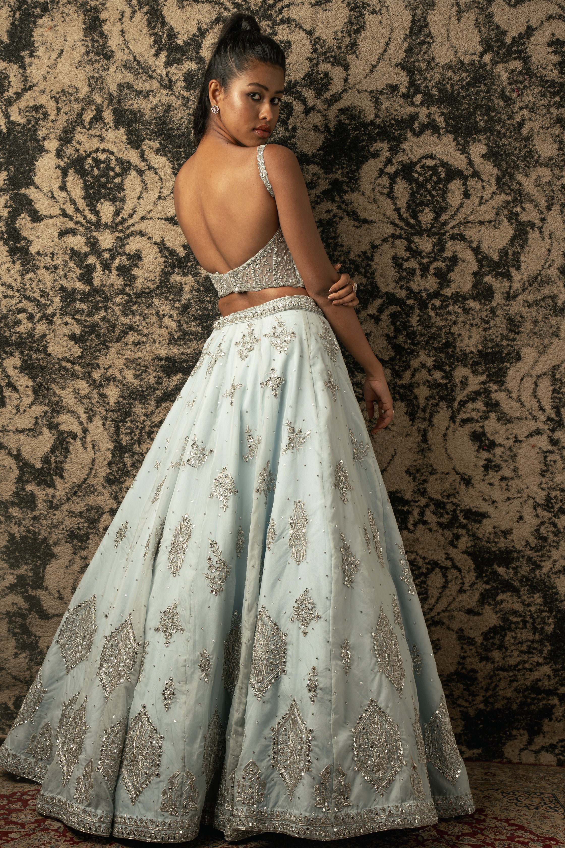 Enchanting in Stellar Blue: Organza Lehenga with Net blouse and Dupatta, a timeless ensemble that captures the essence of celestial charm.