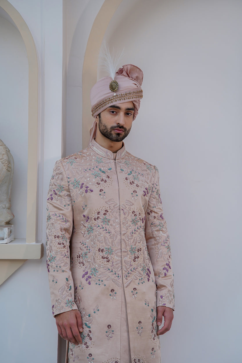 Crafted with intricate embroidery, the Blush In JMC sherwani is a masterpiece of design and craftsmanship.