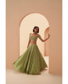 Enchanting in Jade: Hand-embroidered details adorn this green lehenga, a symphony of elegance and grace. 