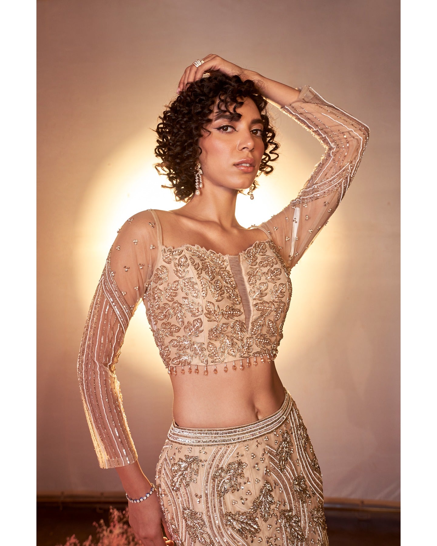 Barely blushing in nude pink: A mesmerizing lehenga that whispers elegance and timeless grace.