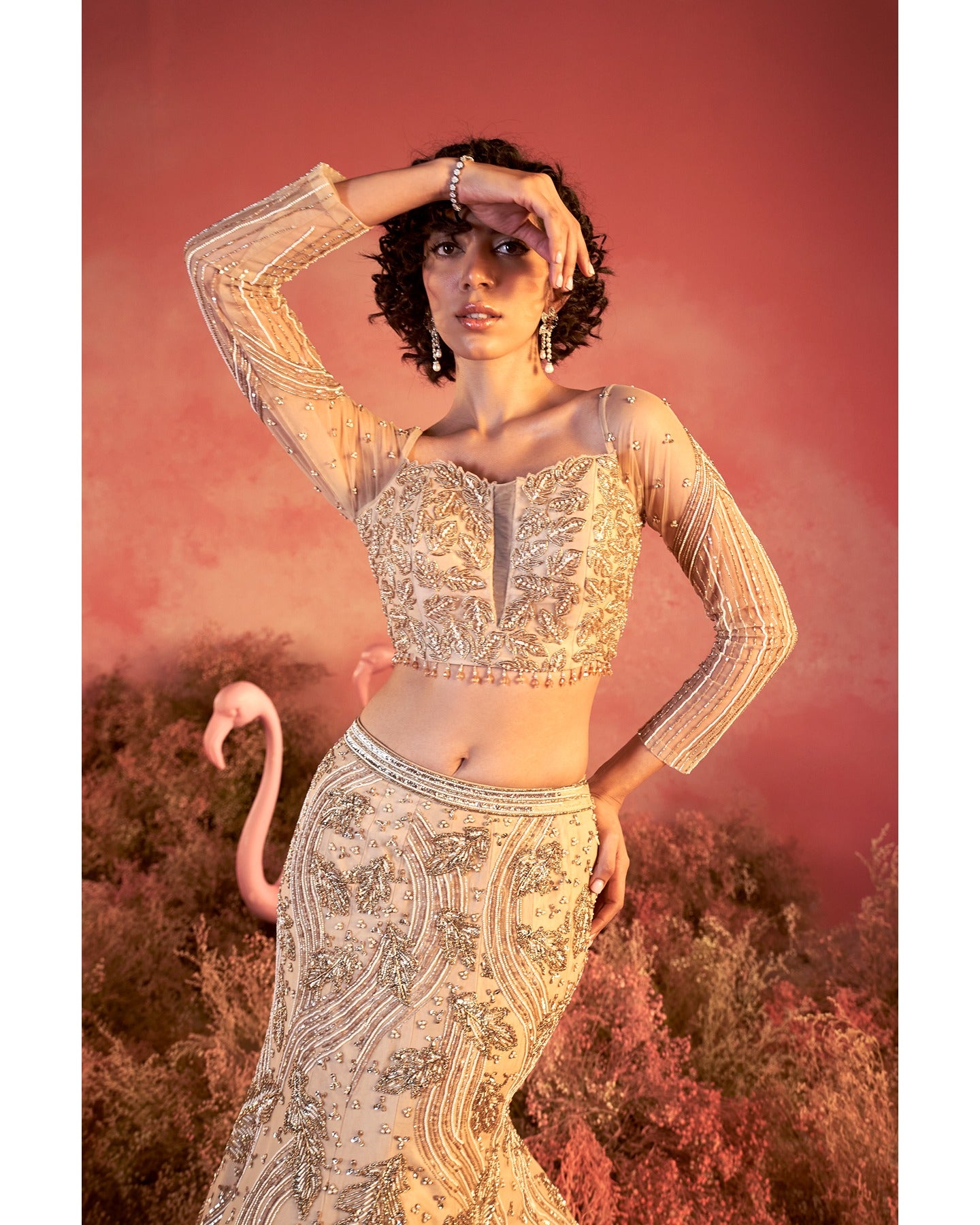 Barely blushing in nude pink: A mesmerizing lehenga that whispers elegance and timeless grace.