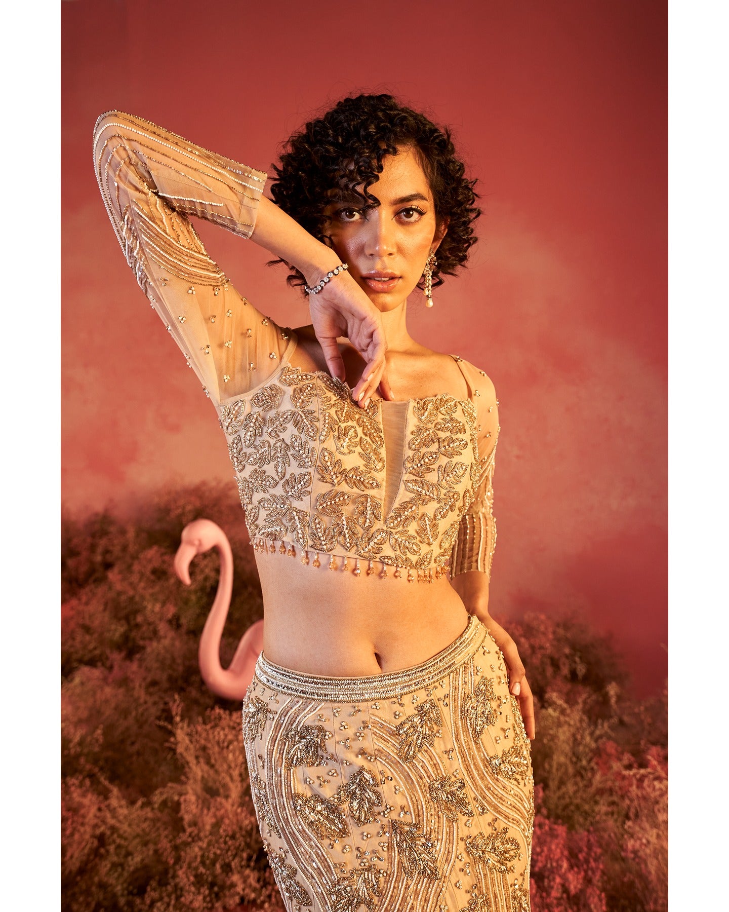Barely blushing in nude pink: A mesmerizing lehenga that whispers elegance and timeless grace.