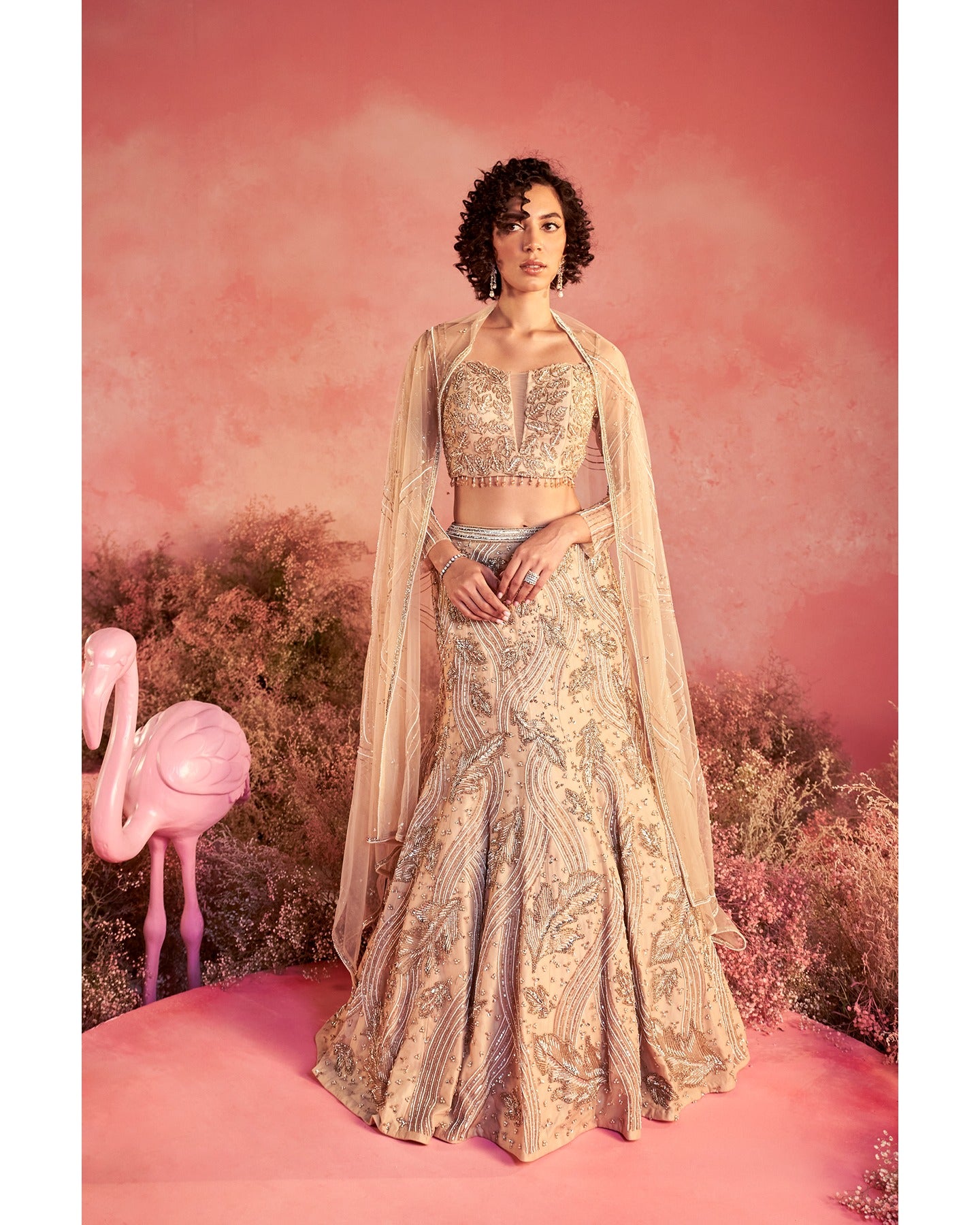 Barely blushing in nude pink: A mesmerizing lehenga that whispers elegance and timeless grace.