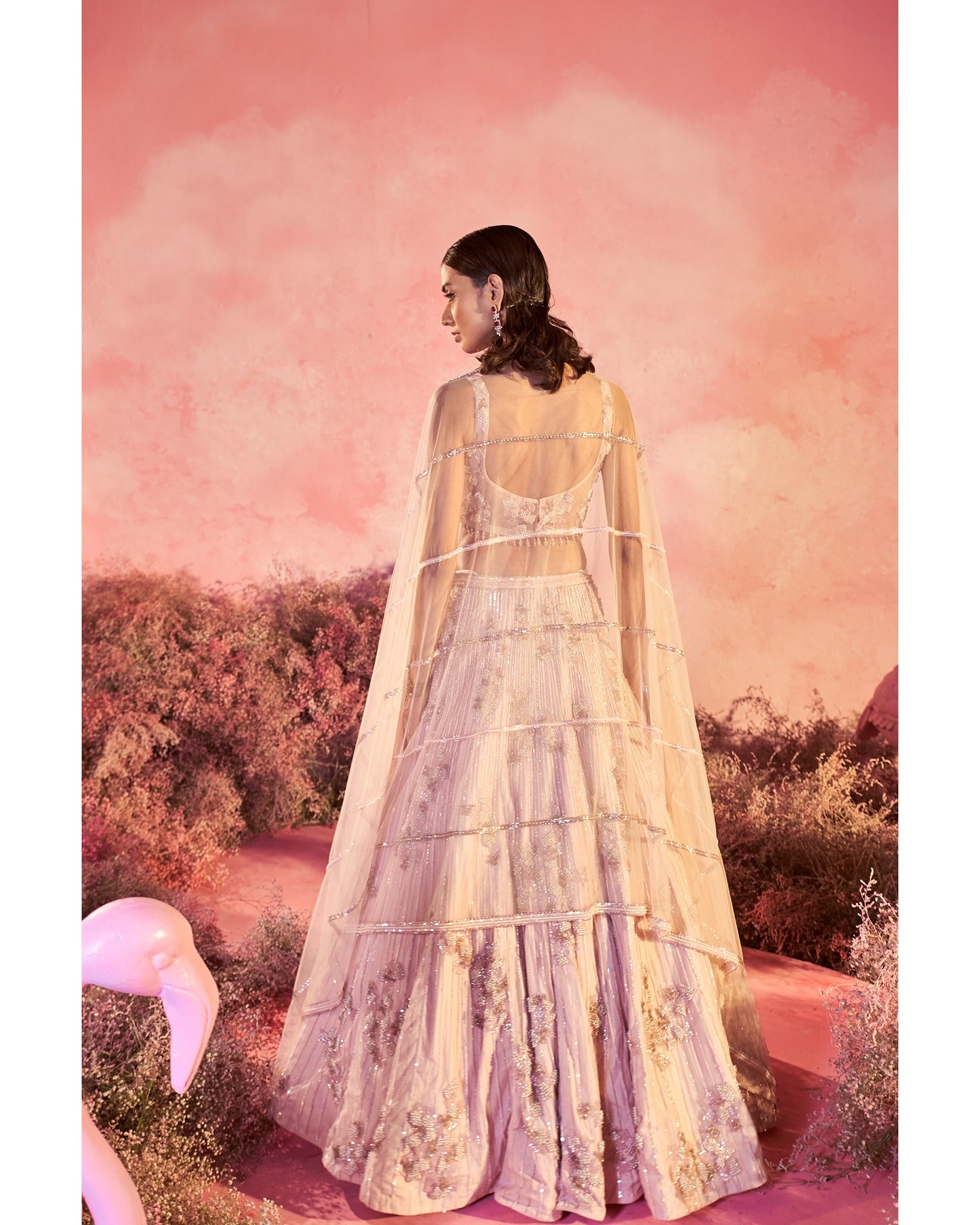 Dream in pink: Embracing the beauty of hand-embroidered details on this enchanting lehenga. 