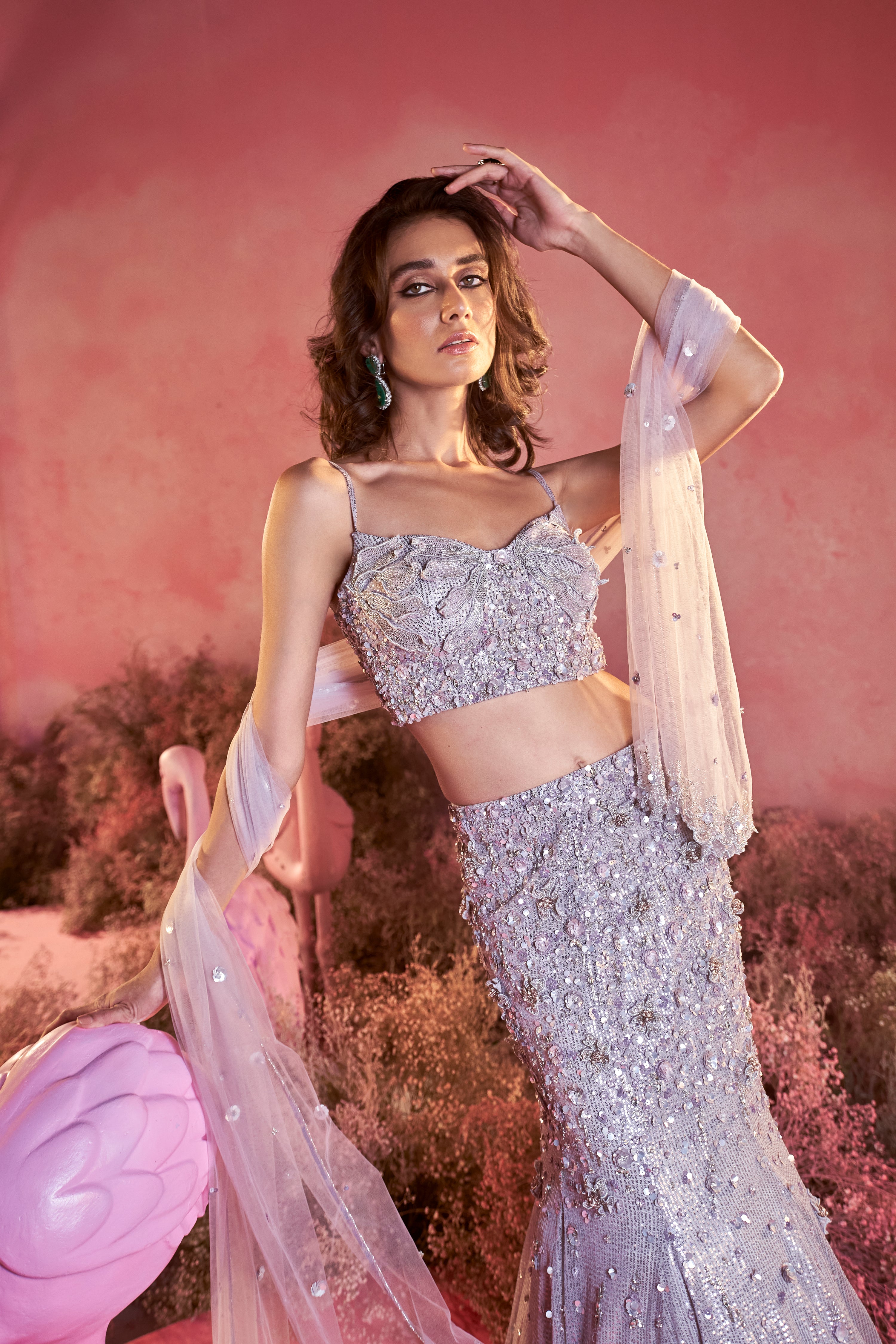 Close-up view of the fine hand-embroidered zardozi work on a royal grey bridal lehenga