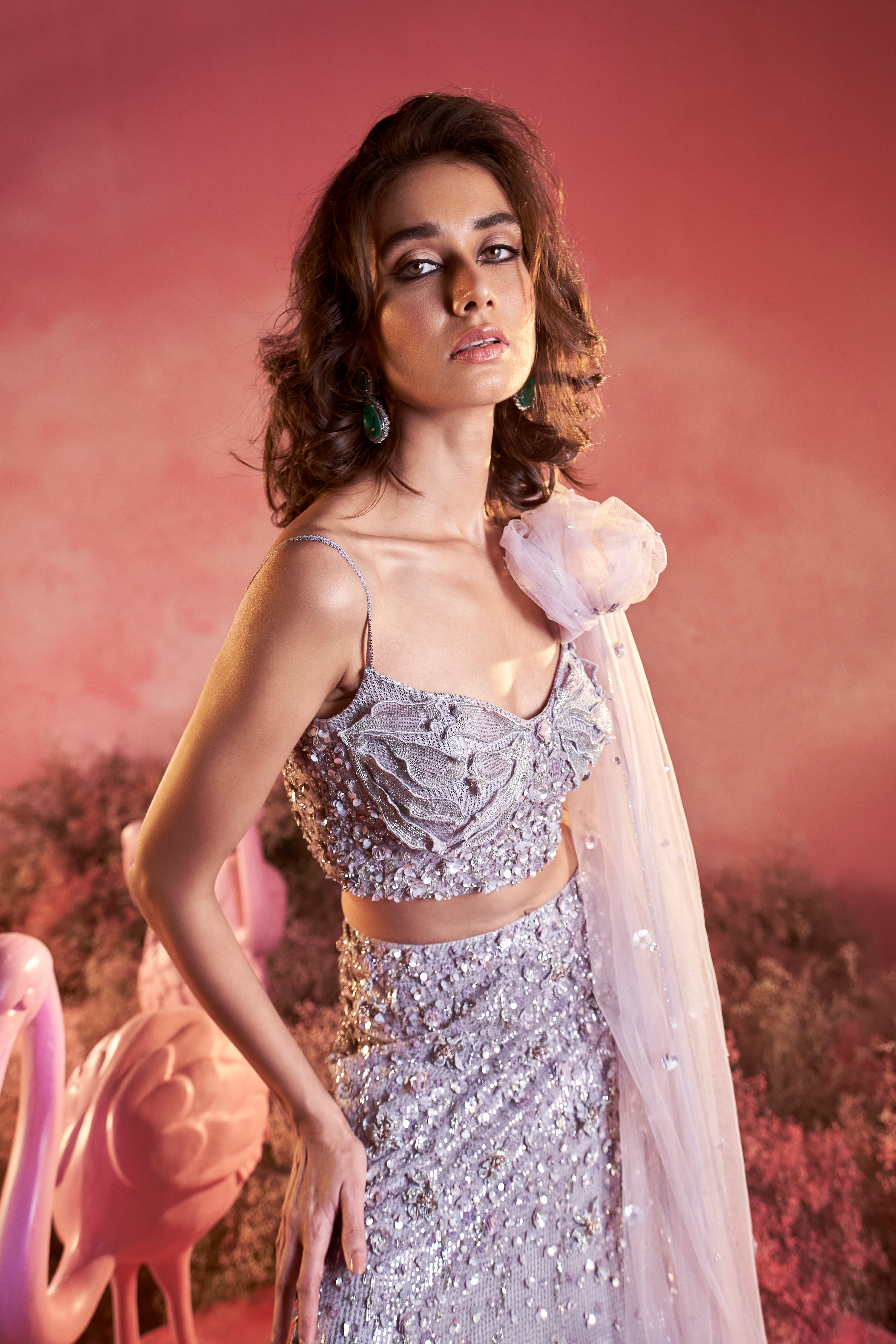 Close-up view of the fine hand-embroidered zardozi work on a royal grey bridal lehenga