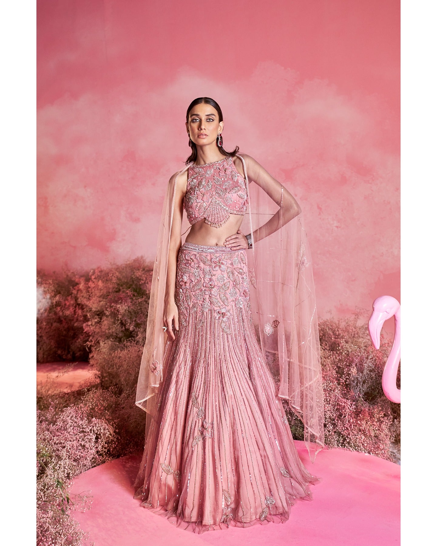 Pink perfection: Unveiling the allure of this stunning lehenga, where elegance meets vibrancy in every twirl.