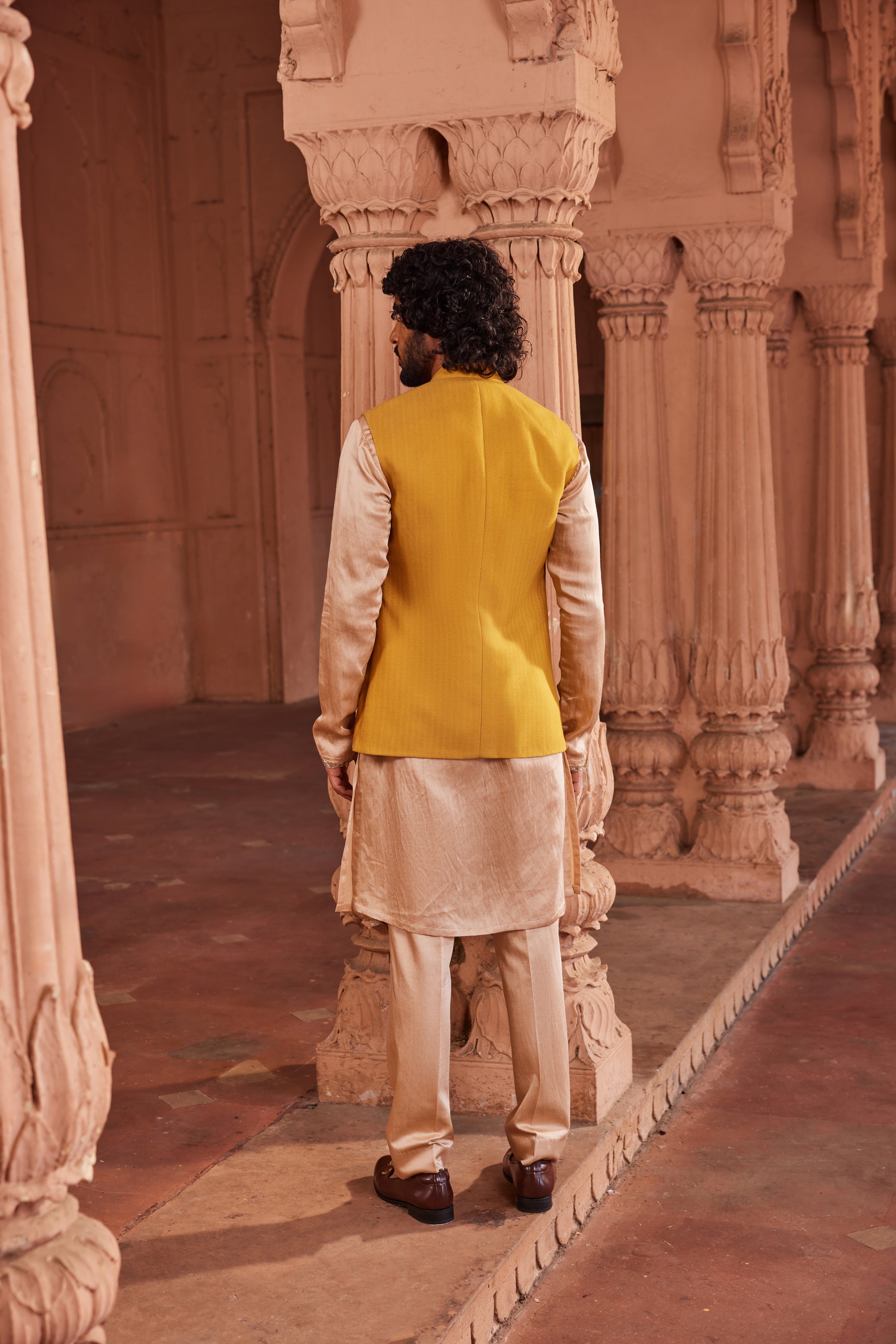 A refined Marigold Nehru Jacket Set, highlighting a hand-embellished jacket with tissue applique work, complemented by a contrasting beige detailed kurta and pants