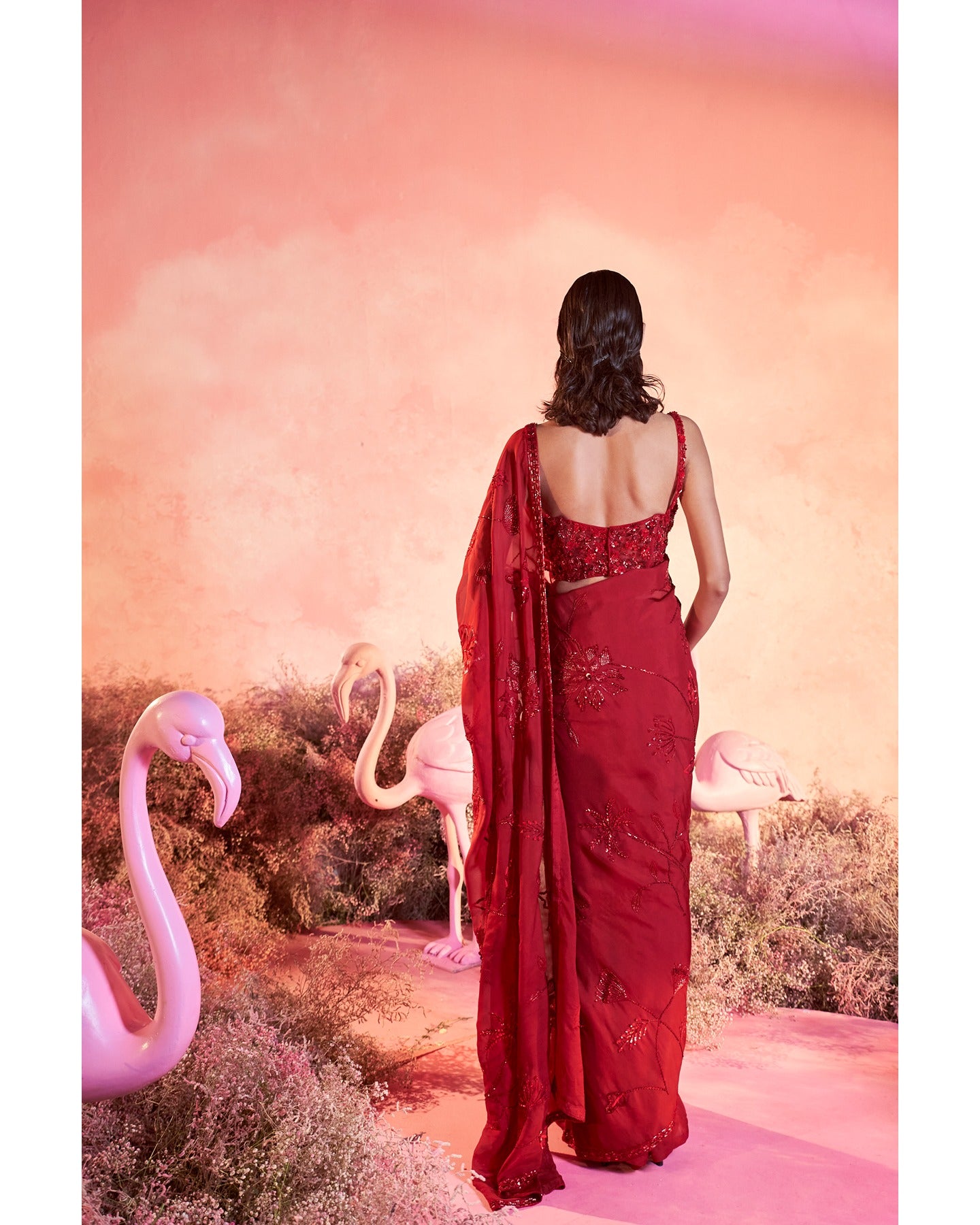Crimson Chic: A vision in red, where hand-embroidery weaves a story of timeless elegance.