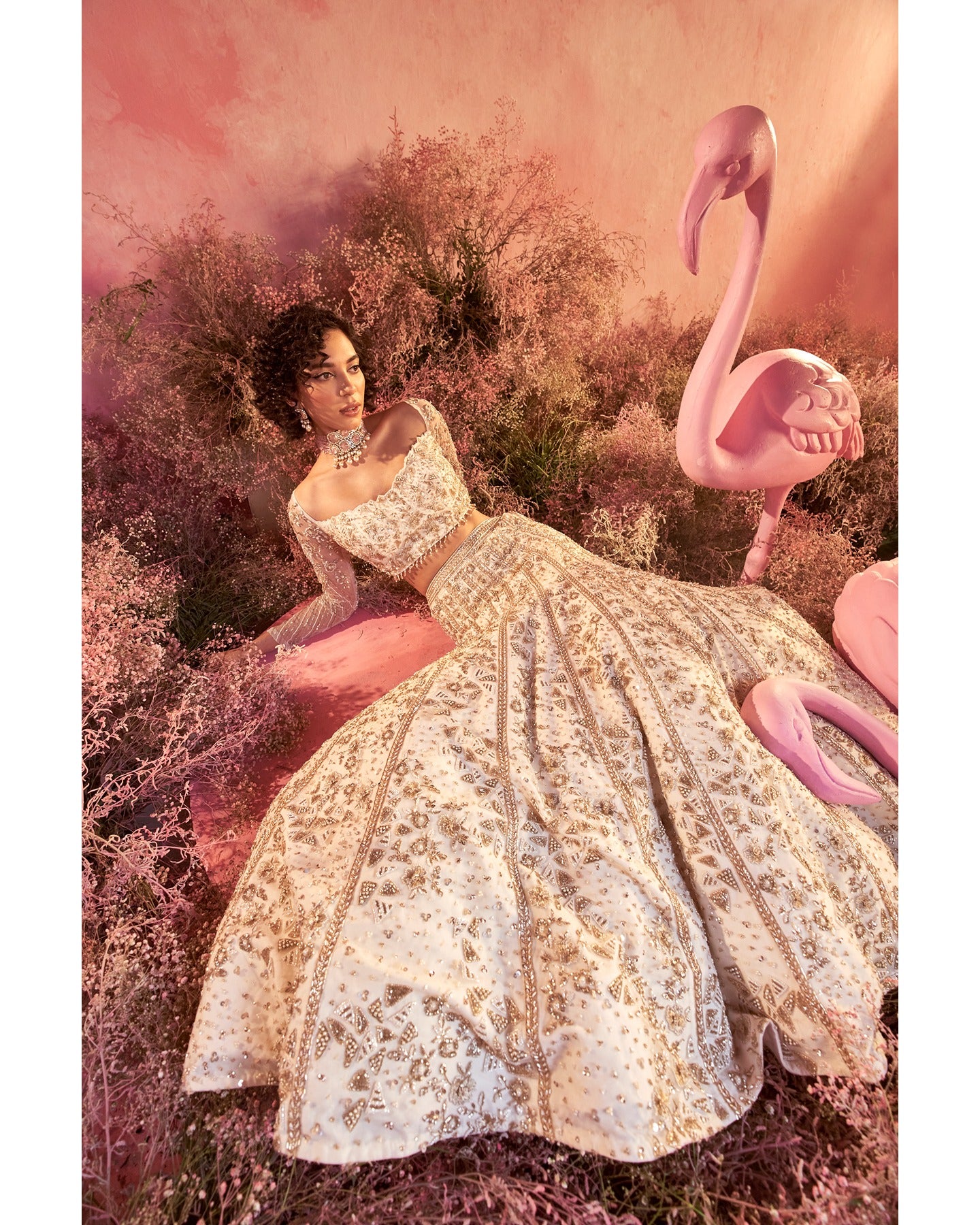 Elegance in every stitch: A white hand-embroidered lehenga that weaves a tale of grace and sophistication.