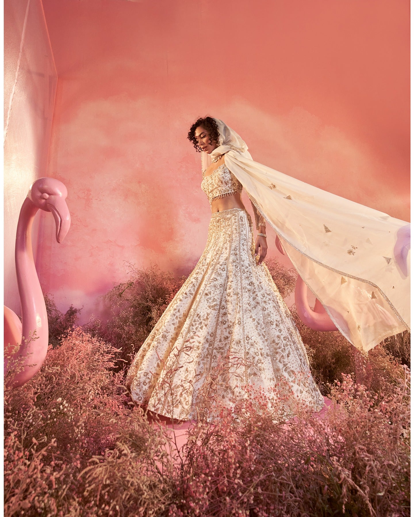 Elegance in every stitch: A white hand-embroidered lehenga that weaves a tale of grace and sophistication.