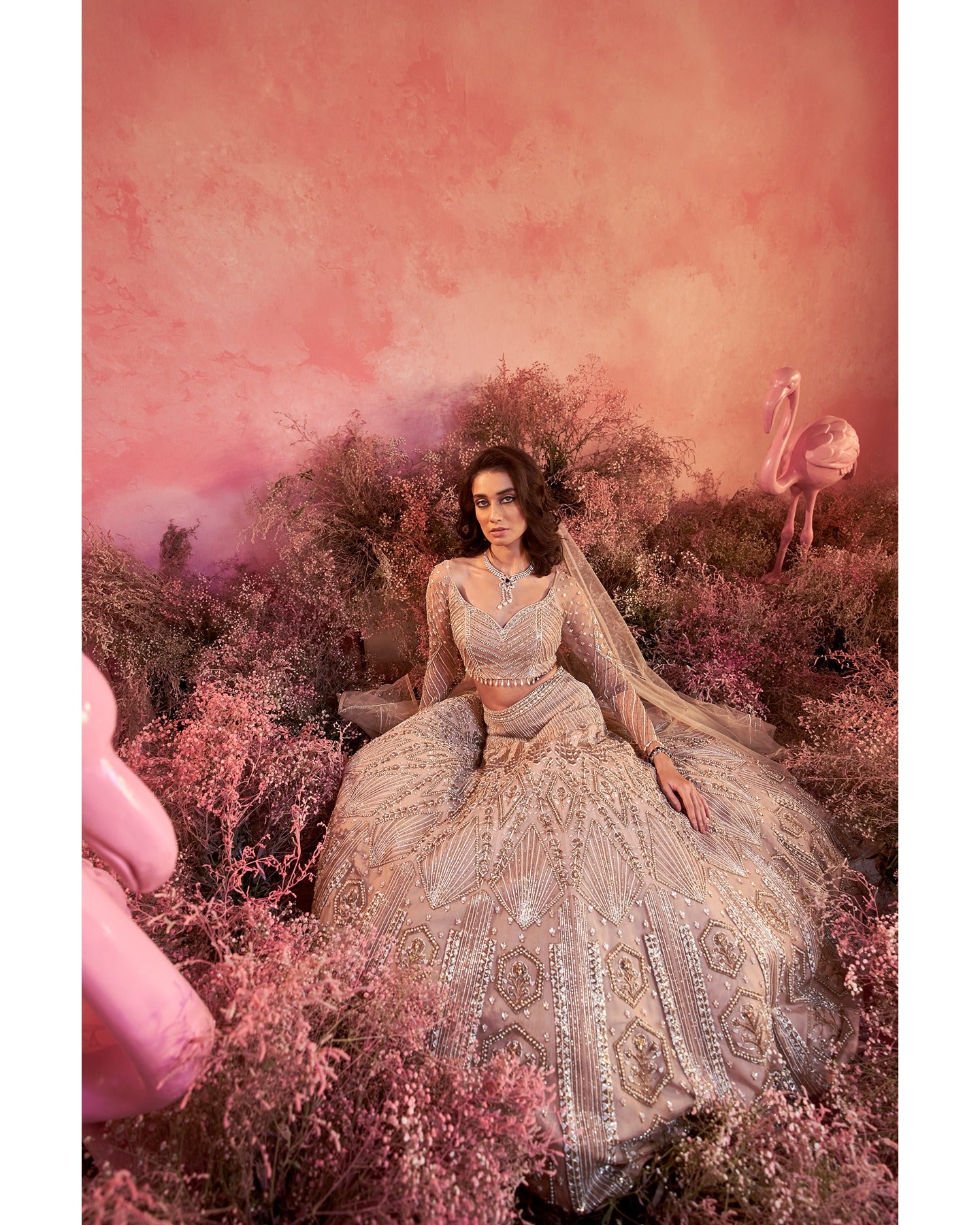 Whispers of artistry in nude tones: A hand-embroidered lehenga that radiates elegance and grace.