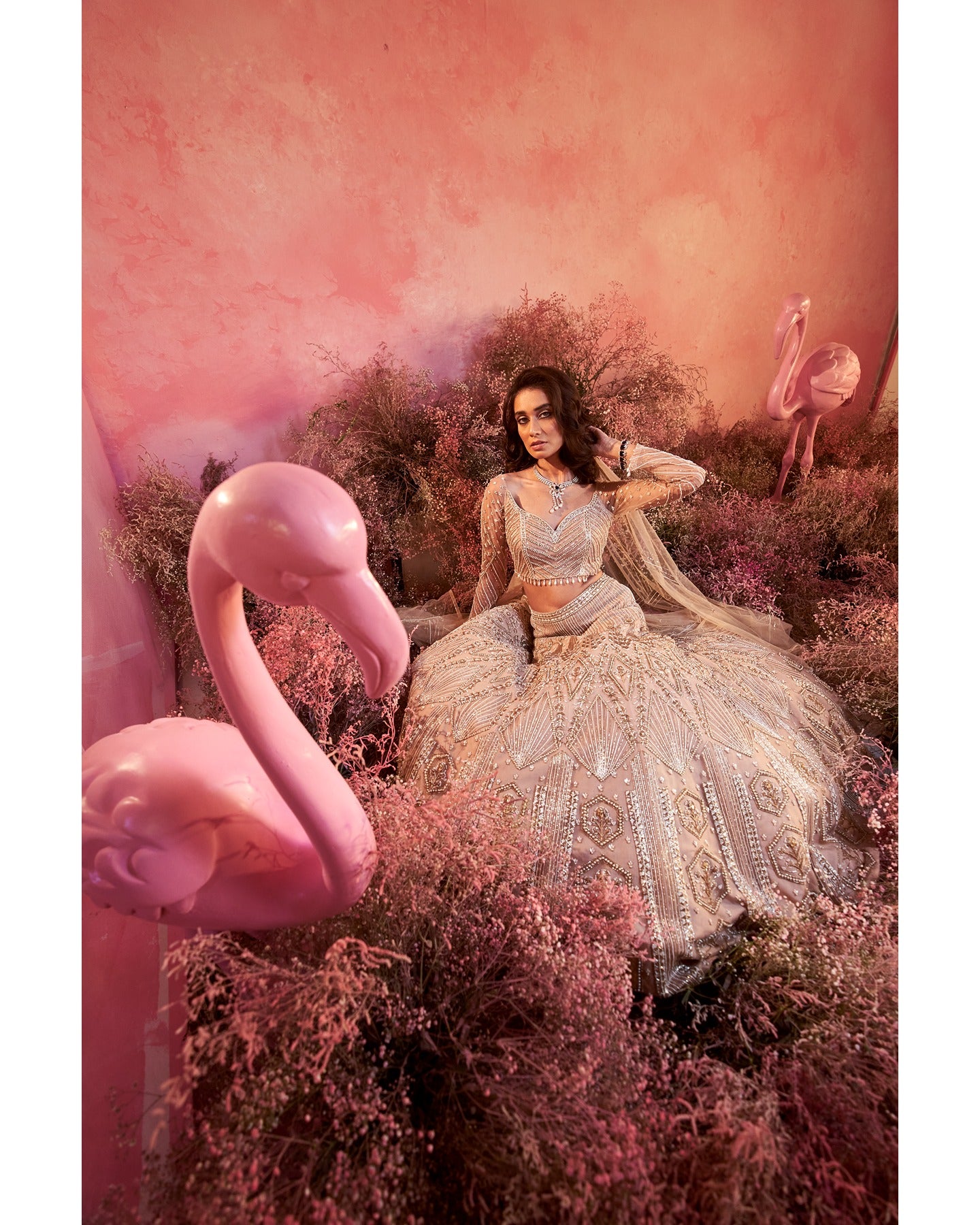 Whispers of artistry in nude tones: A hand-embroidered lehenga that radiates elegance and grace.