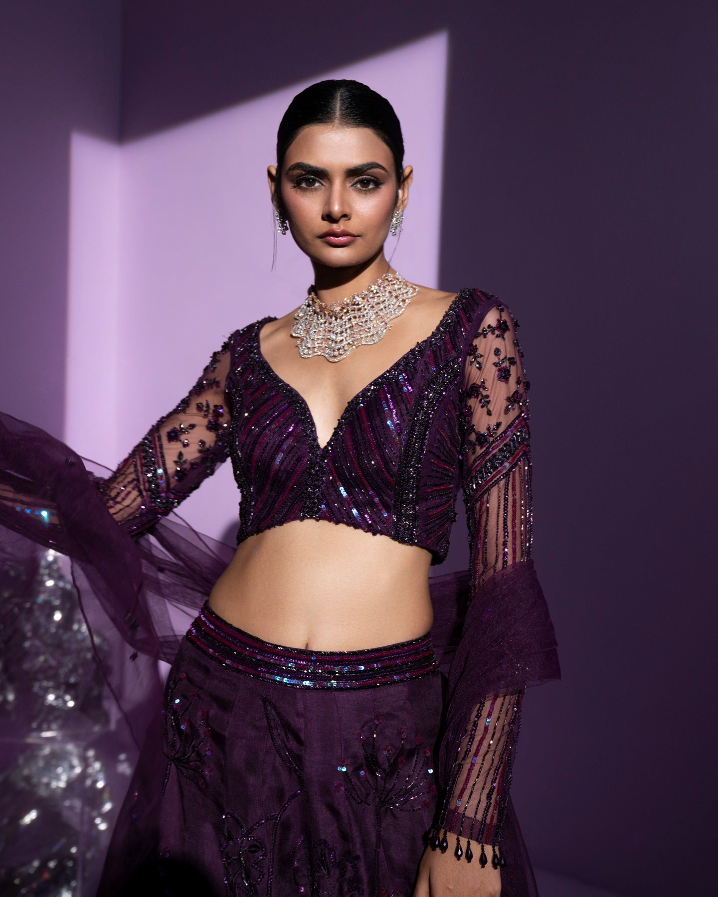 Draped in regal hues, this purple lehenga is a symphony of grace and sophistication. A royal dance of color and intricacy, commanding attention with every twirl. 