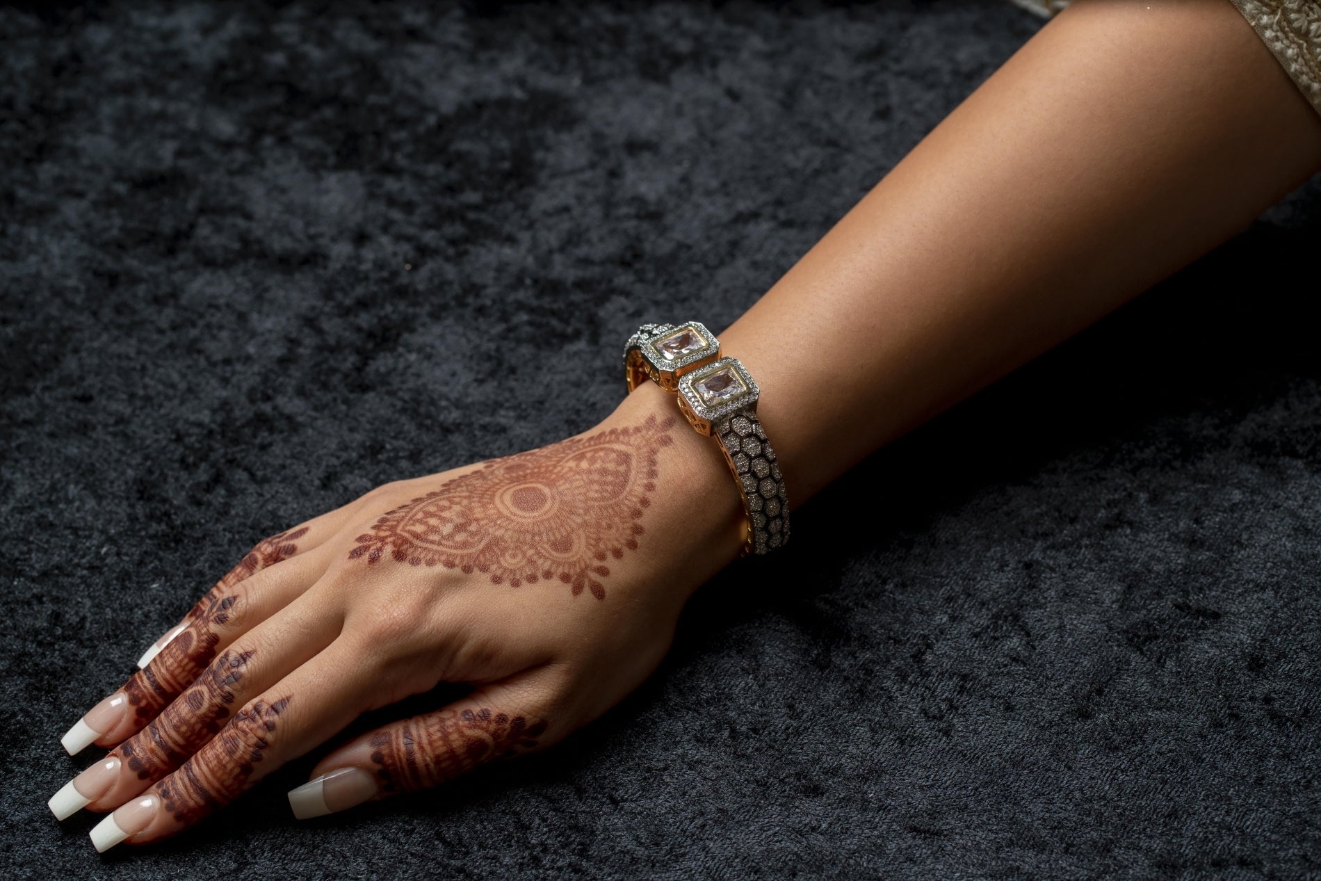 Silver cuff bracelet with stone ends