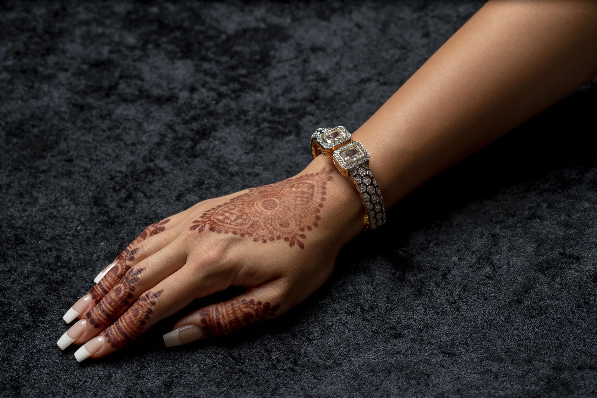 Silver cuff bracelet with stone ends