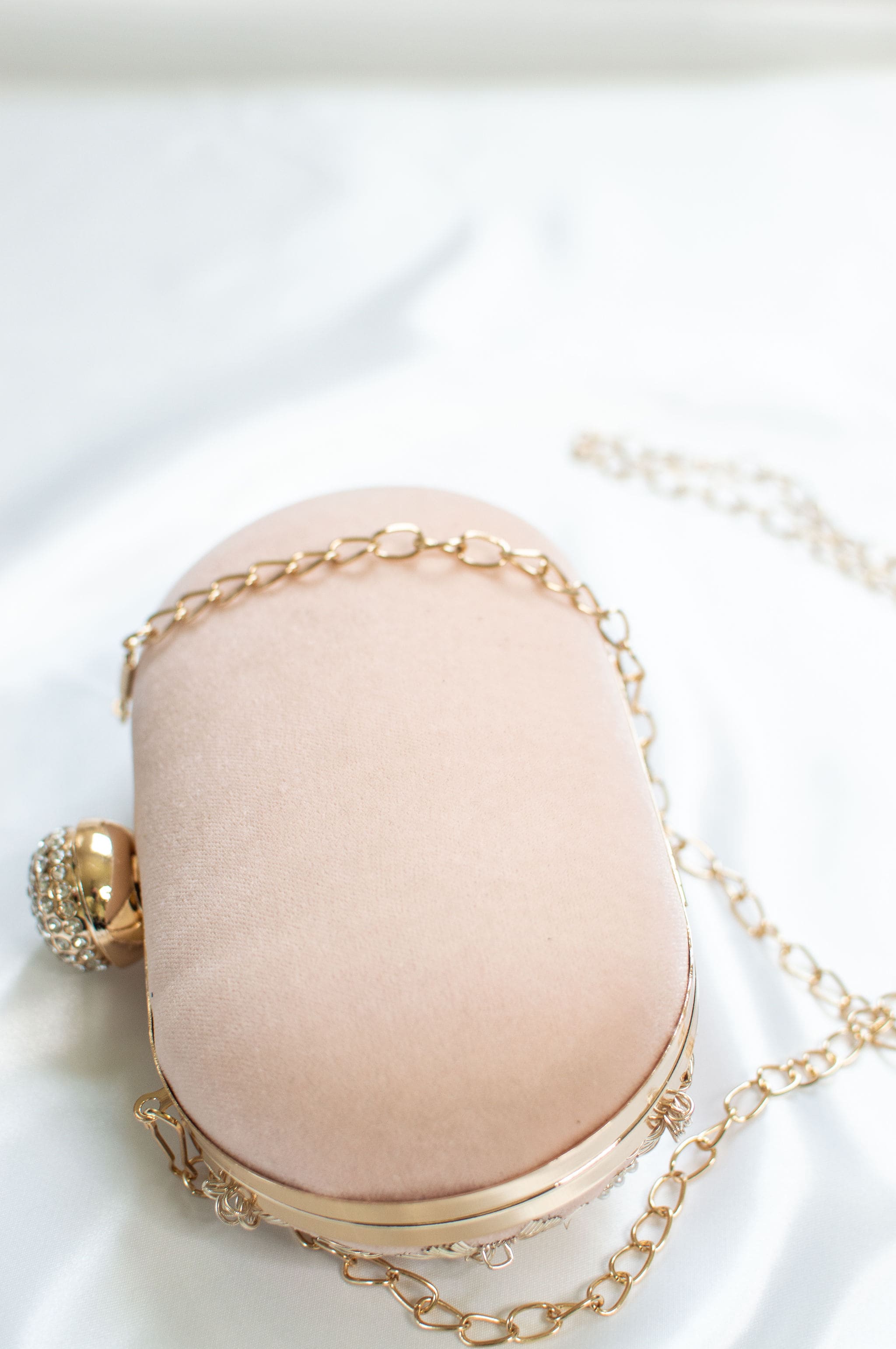 Peach fabric clutch with Zardozi & Pearl work