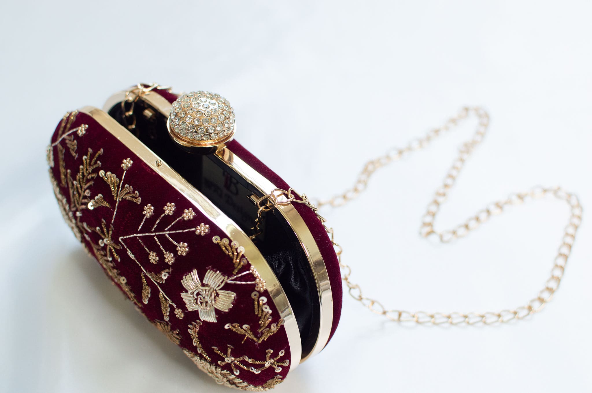 Burgundy clutch bag w/ detachable gold chain strap